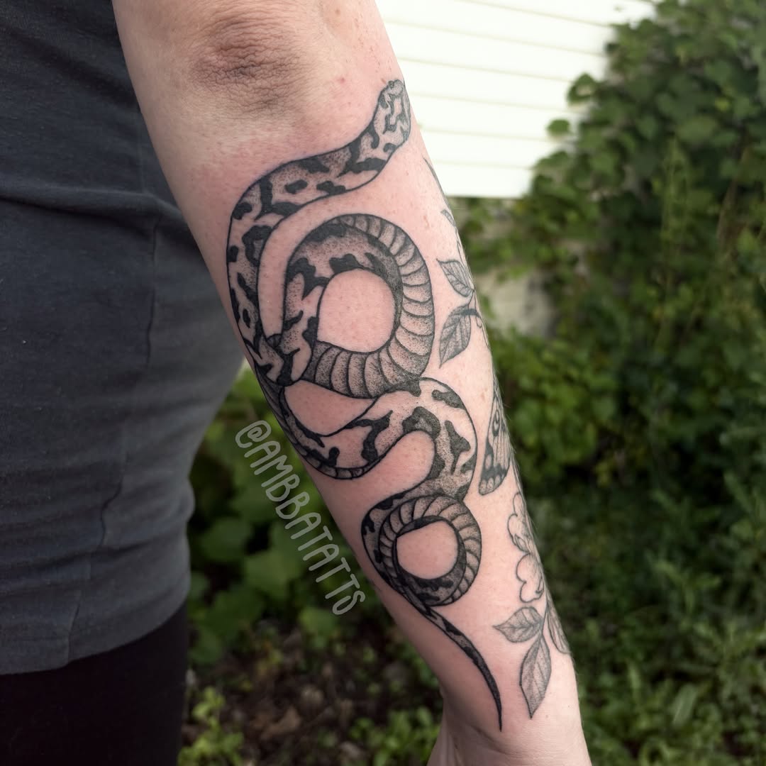 Snake black and grey tattoo on the forearm by amber brady, Brunswick, Ohio