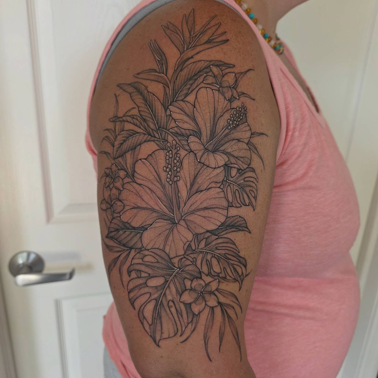 Floral arrangement realism tattoo on the shoulder by Dani Bond