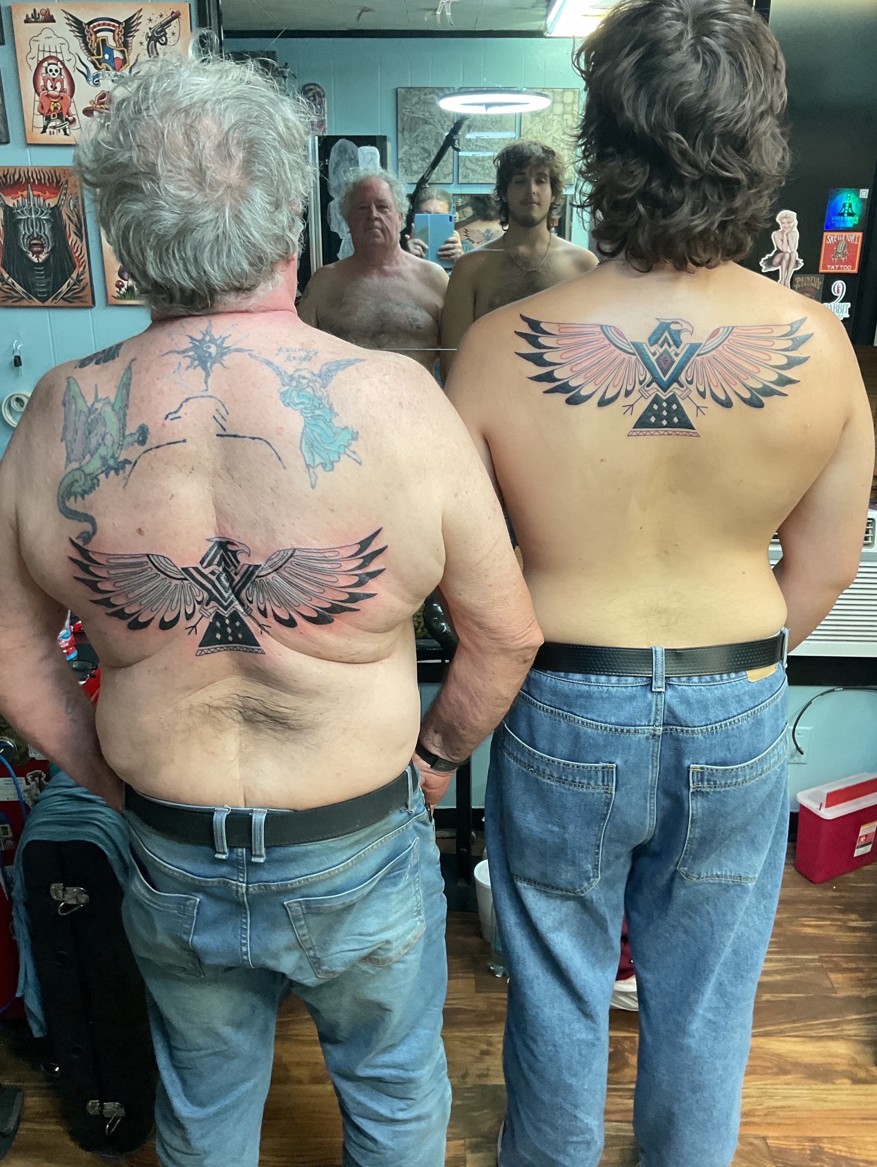 Wings and triangle American traditional tattoo on the back by Roachrude