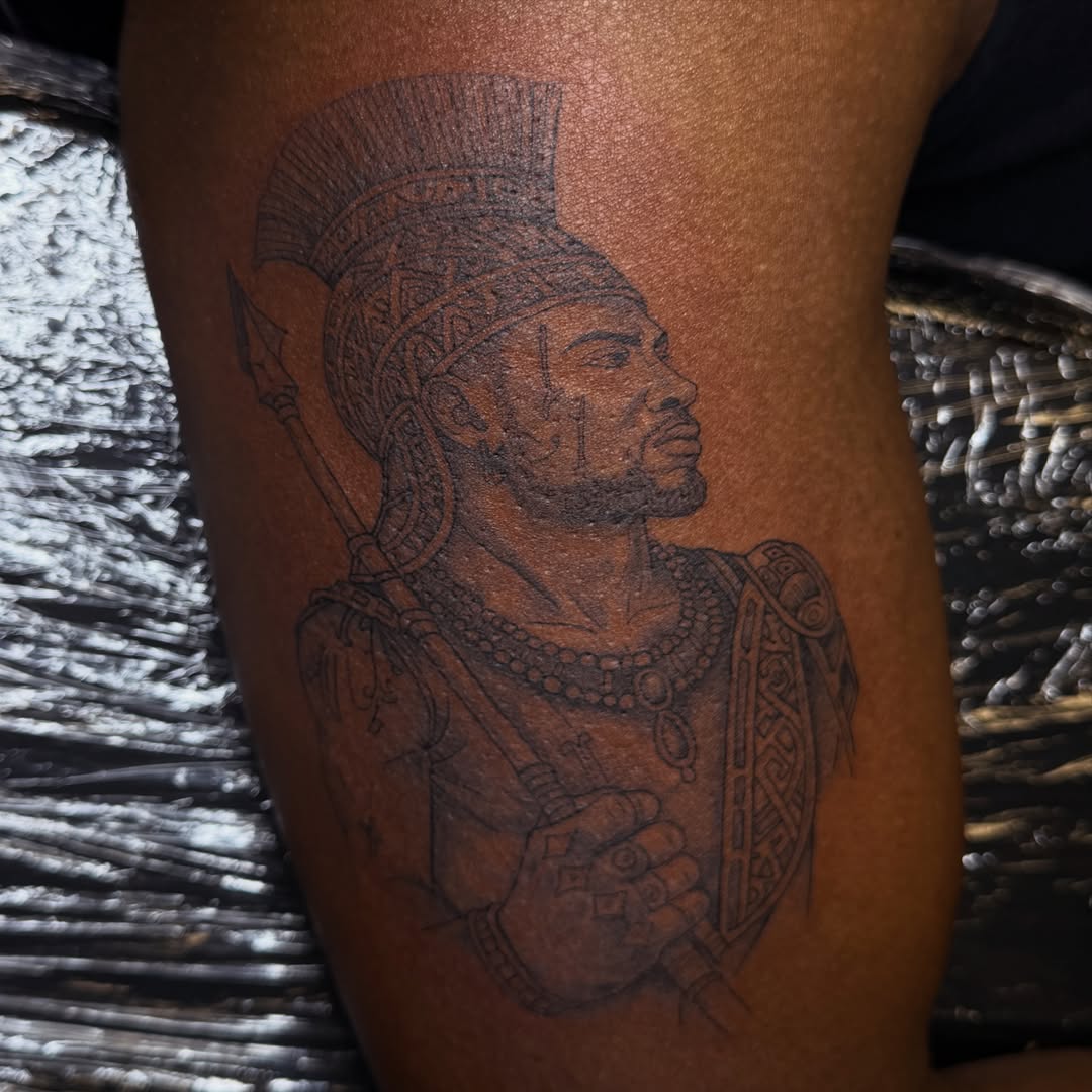 Ancient warrior black and grey tattoo on the thigh by Pretty Ugly Tattoos