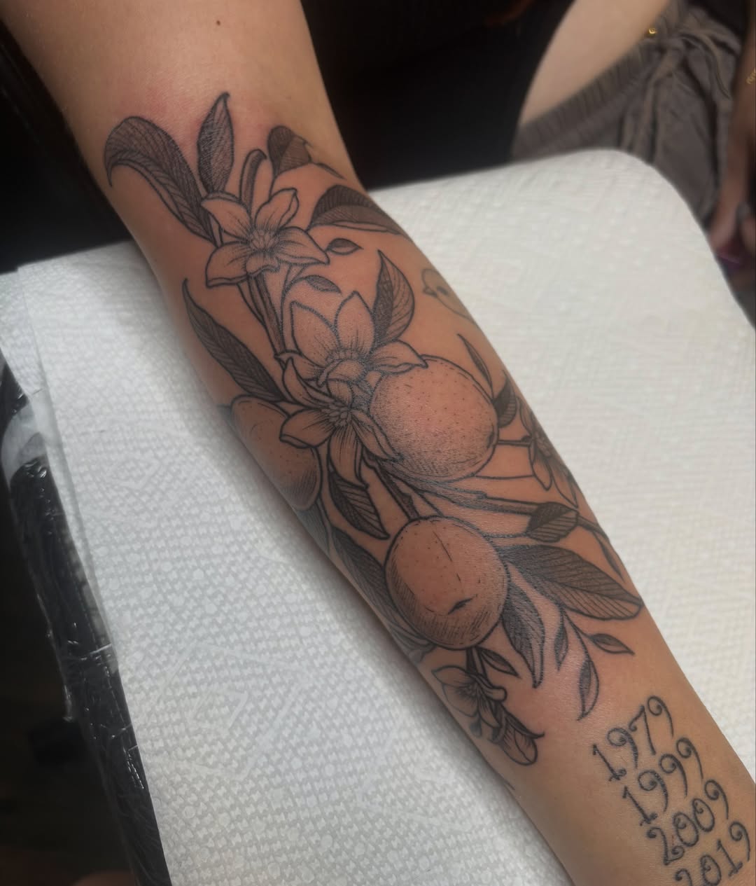 Fruit and floral arrangement realism tattoo on the forearm by š¤Madeline Kristenš¤, Somerset, Wisconsin
