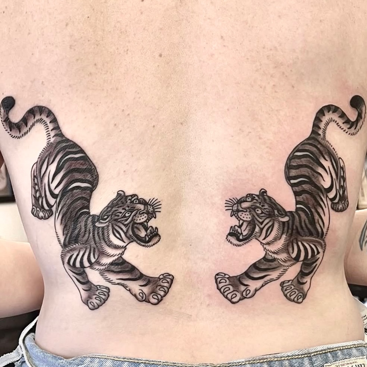 Tigers black and grey tattoo on the back by @brandonhuckabey, Denver, Colorado