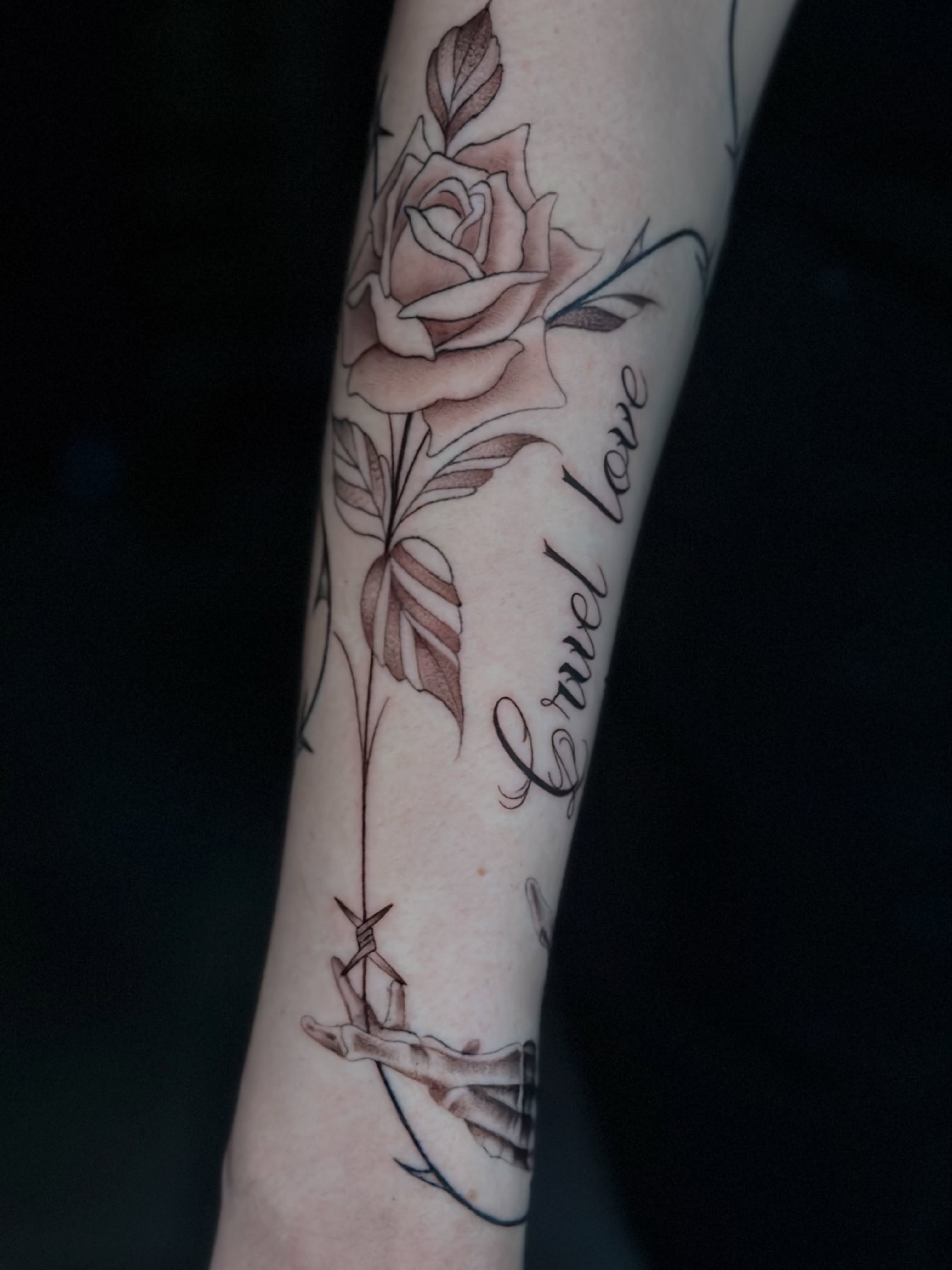 Rose black and grey tattoo on the forearm by Persia Leilani