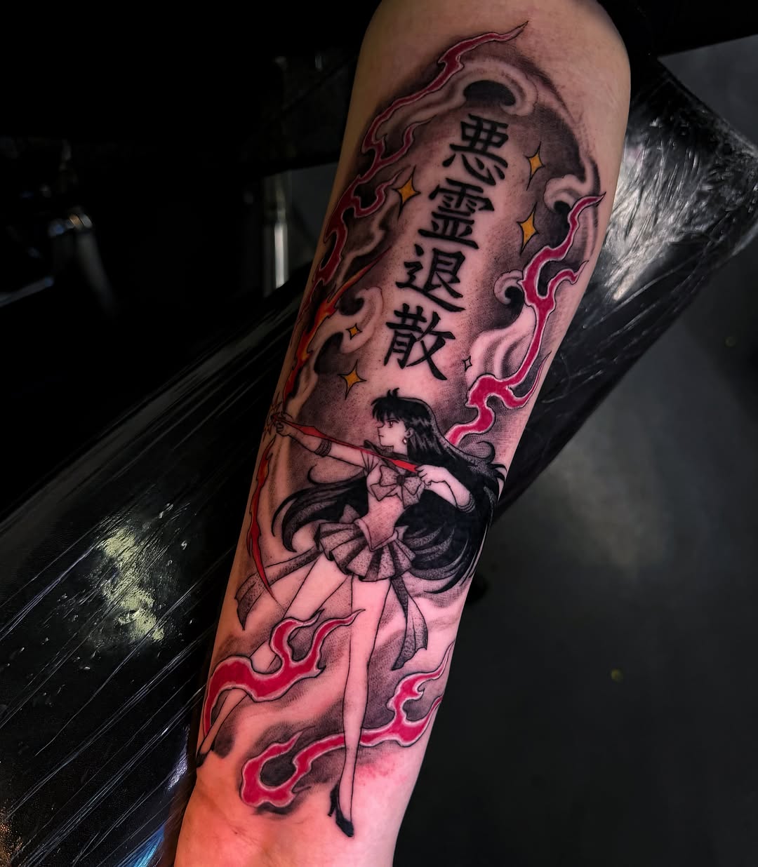 Anime character with kanji anime tattoo on the forearm by Melissa "Lotuss" Chan