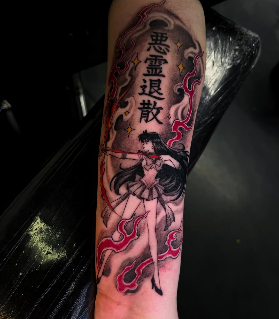 Anime character with Japanese text anime tattoo on the forearm by Melissa "Lotuss" Chan