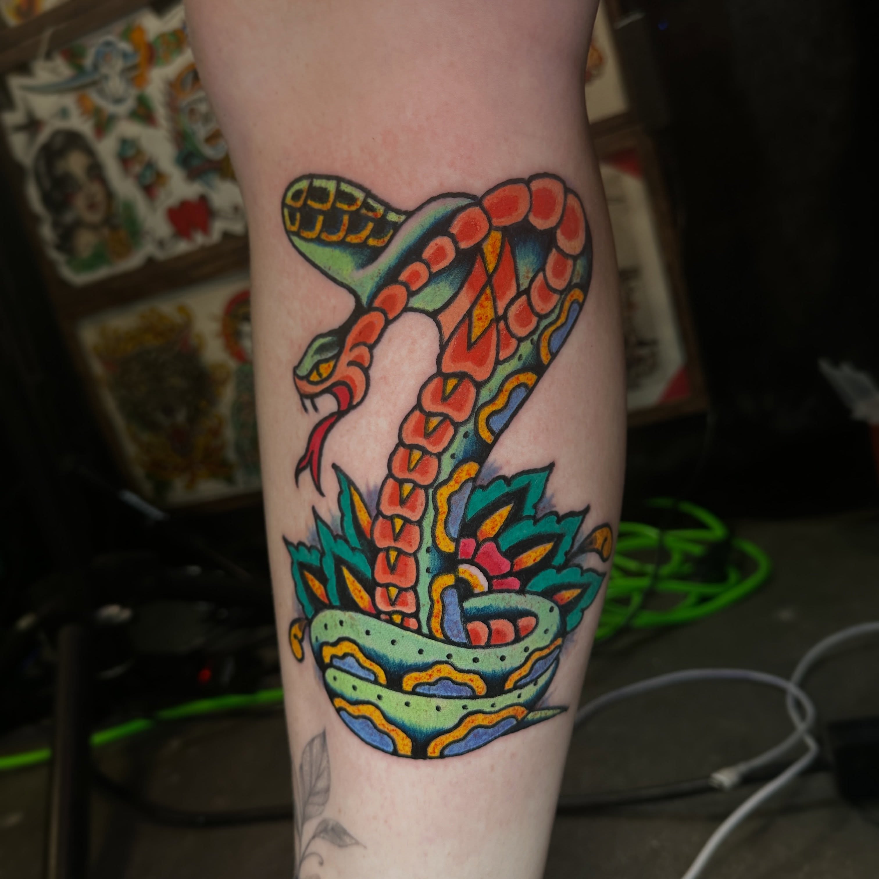 Snake and peony American traditional tattoo on the forearm by Matthew Tattooer Harman