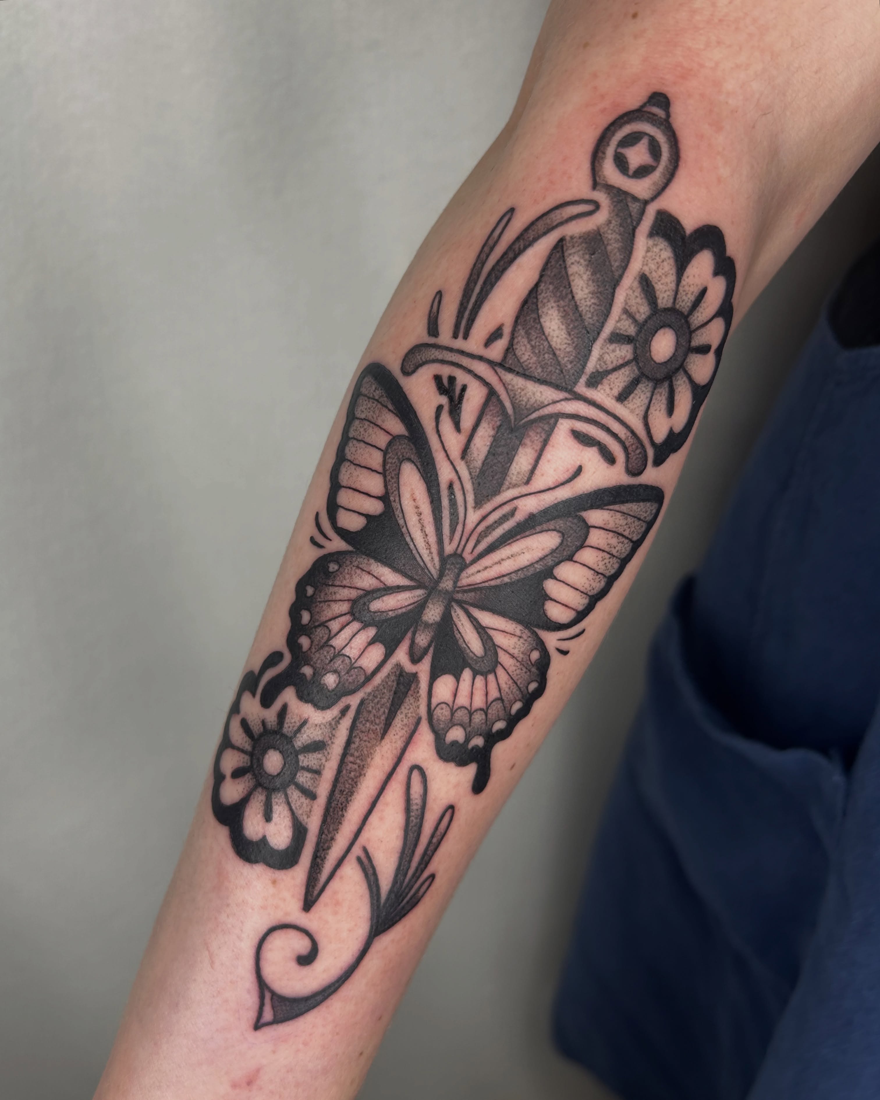 Butterfly and flowers dotwork tattoo on the forearm by Aaron Murray ✨ Michigan Tattoo Artist