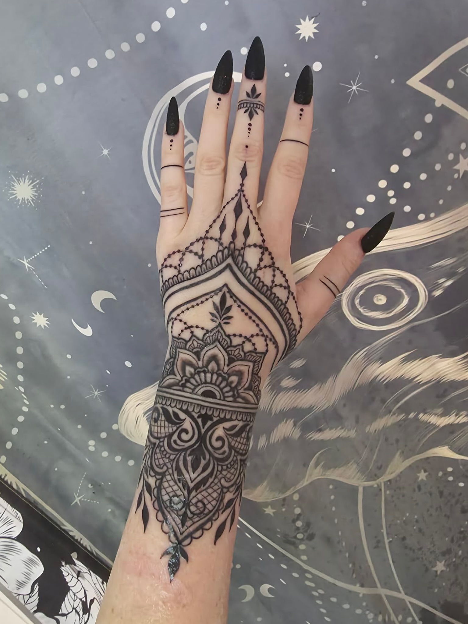 Mandala geometric tattoo on the hand by Olivia Suzanne Fada