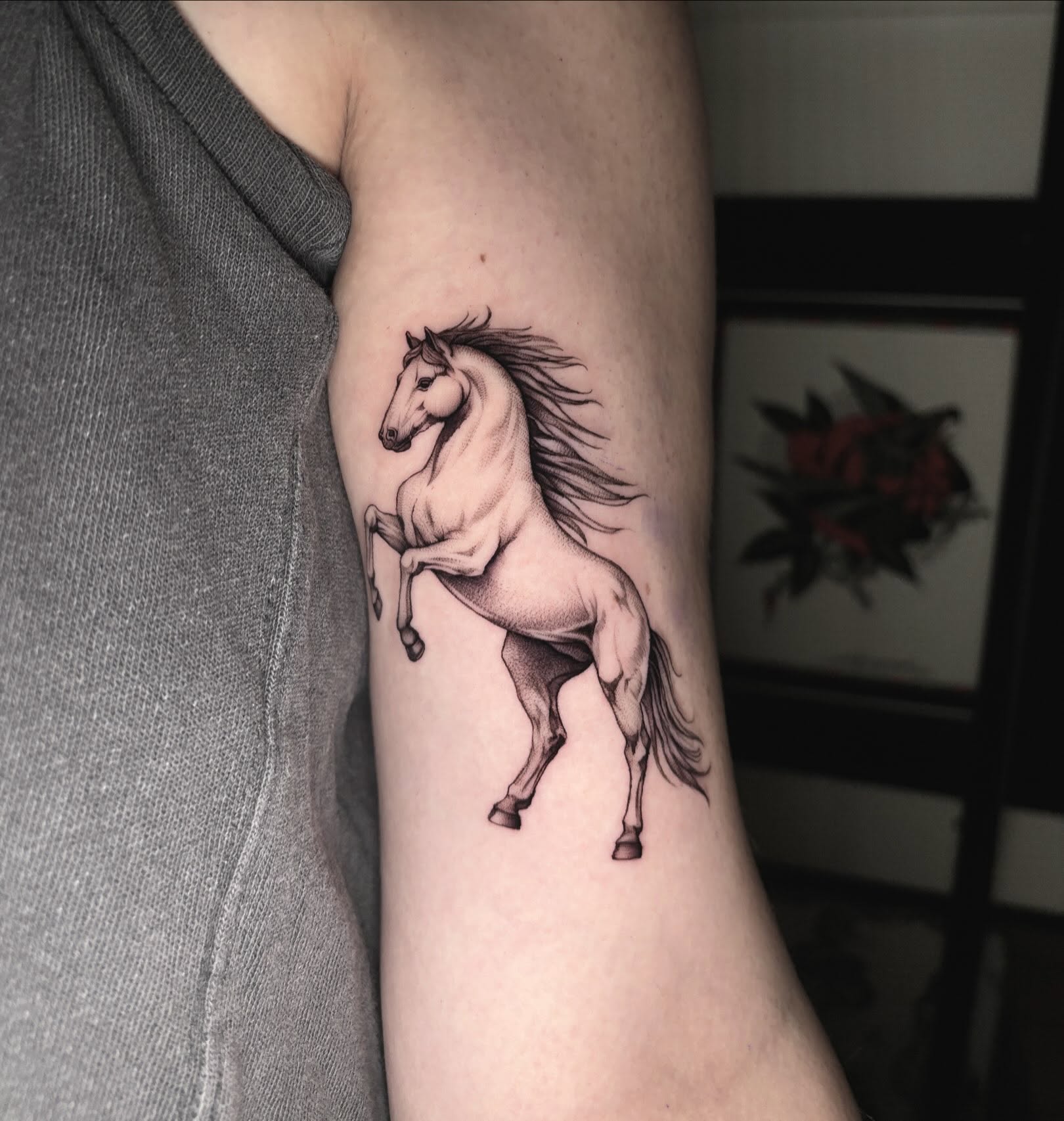 Galloping horse realism tattoo on the forearm by Emma Cotter