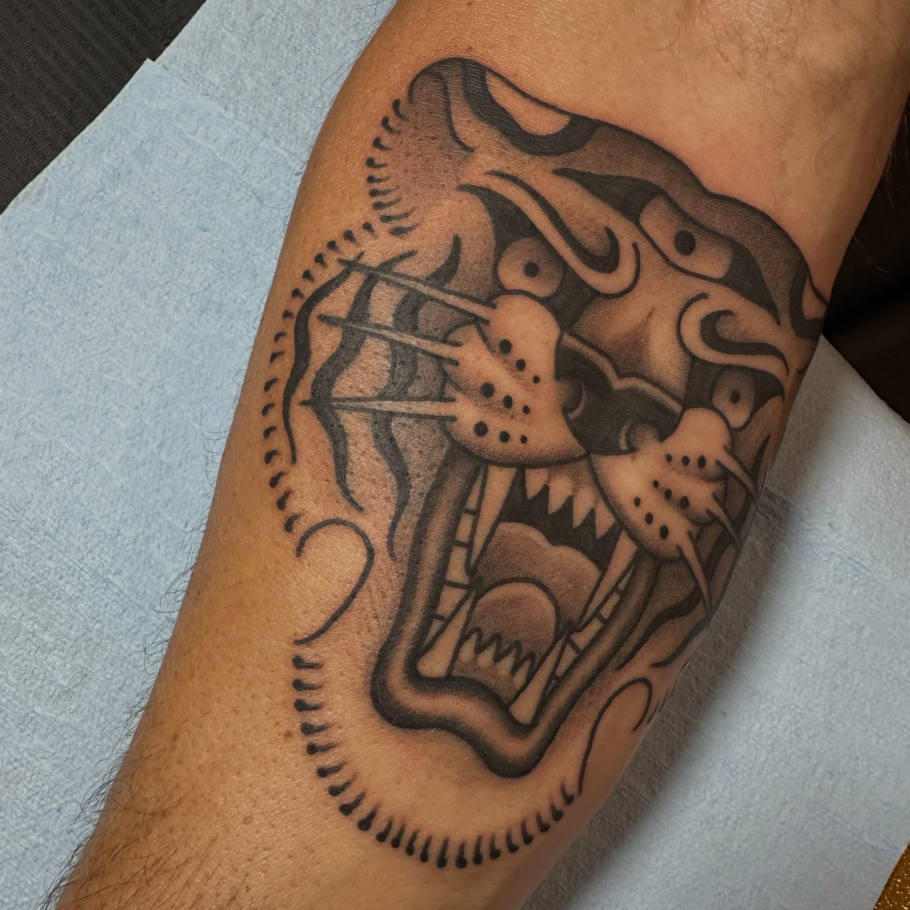 Demon black and grey tattoo on the forearm by Kyle Logan Frary