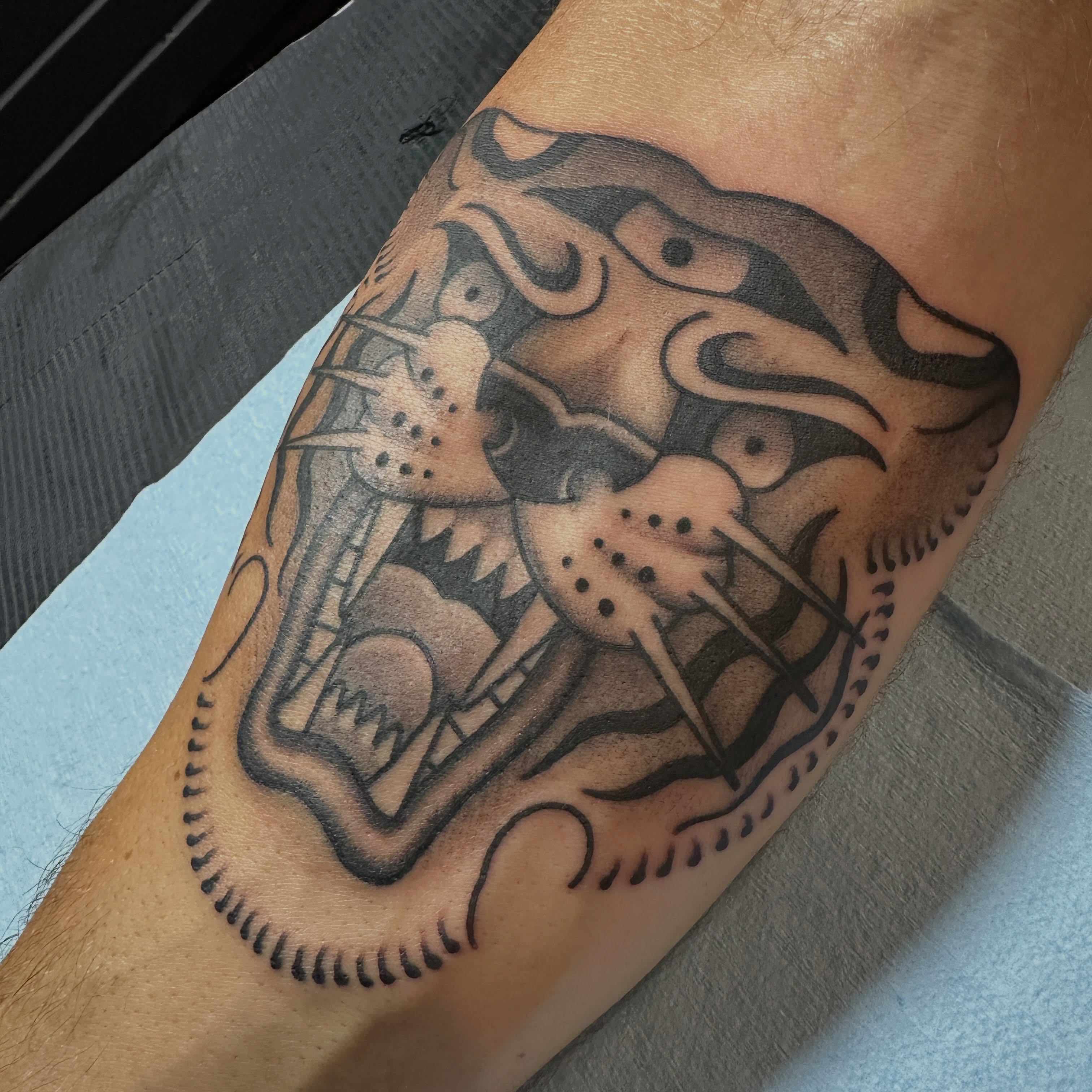 Panther American traditional tattoo on the forearm by Kyle Logan Frary