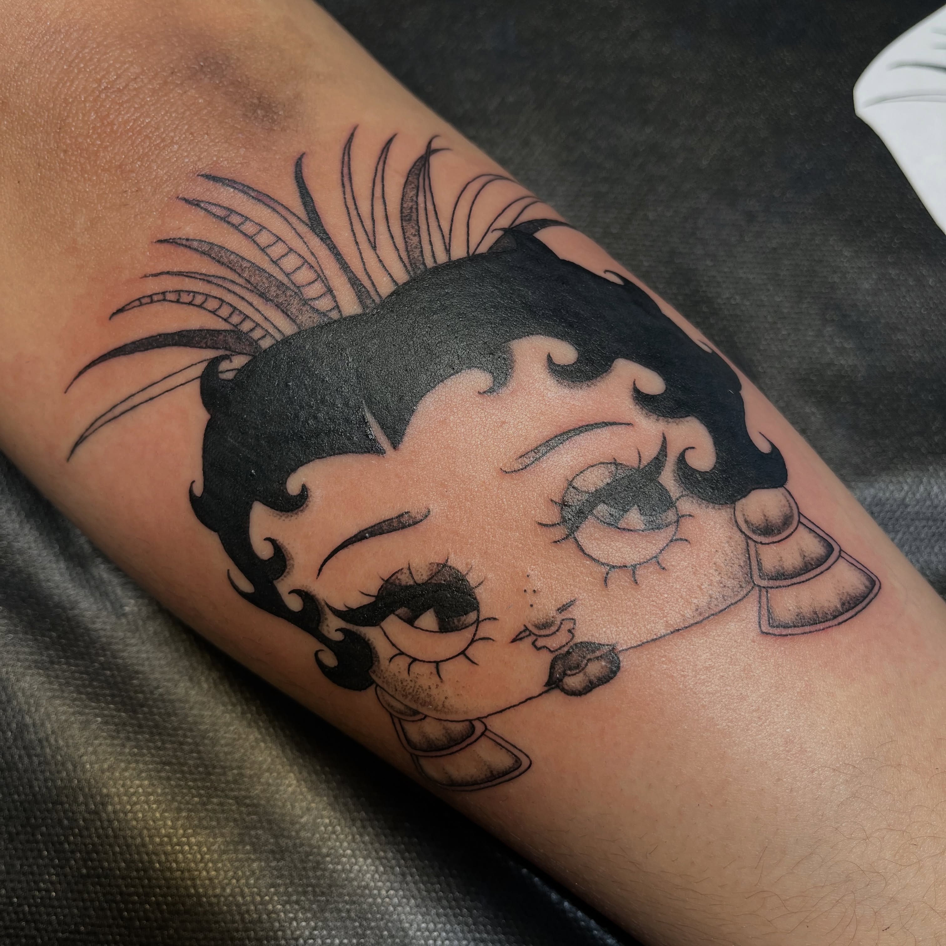 Betty Boop American traditional tattoo on the forearm by christina diaz