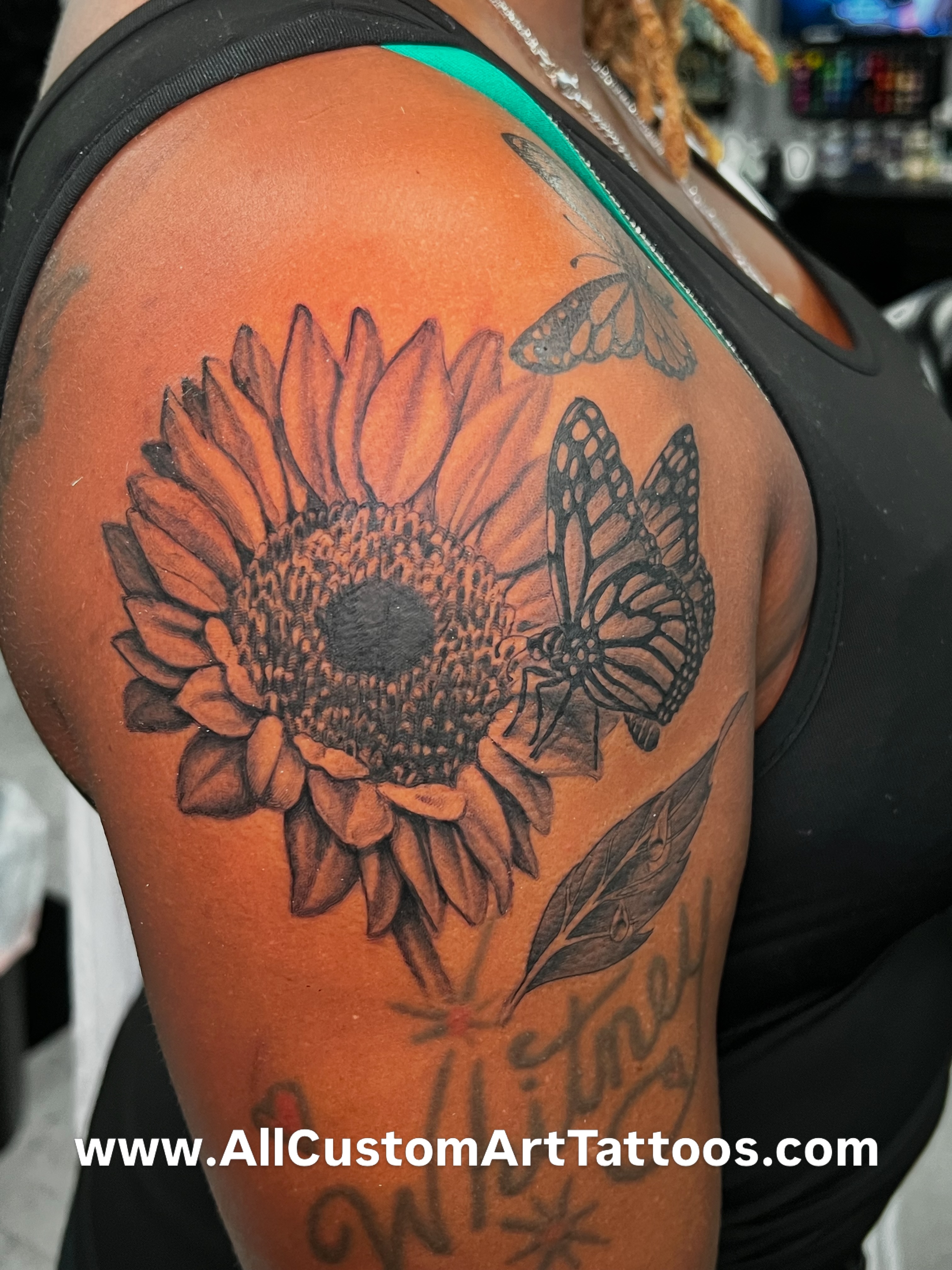 Sunflower and butterflies realism tattoo on the shoulder by Rafael Marte, White Plains, New York
