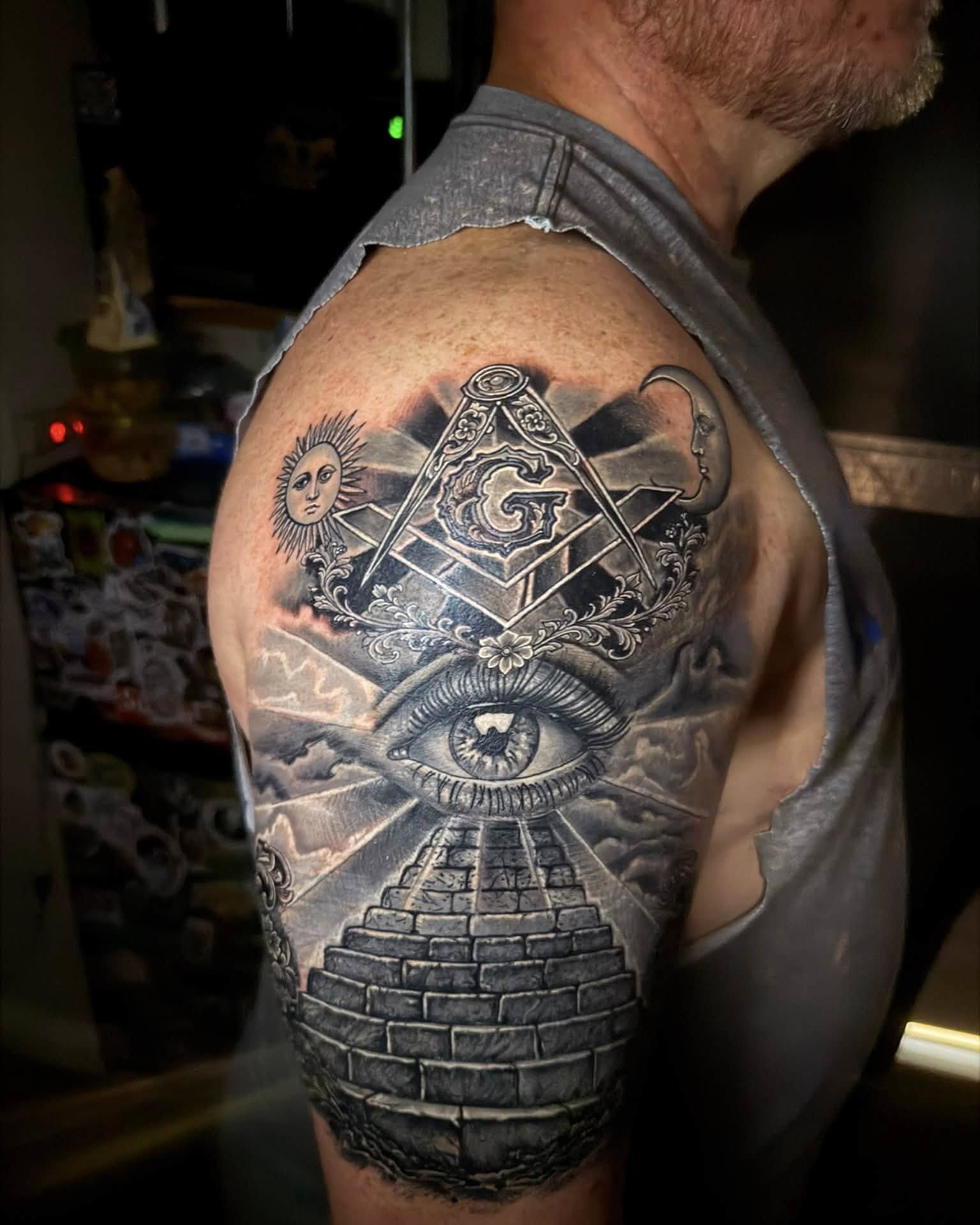 Eye and pyramid realism tattoo on the shoulder by Corey Bailey, Stanton, Kentucky