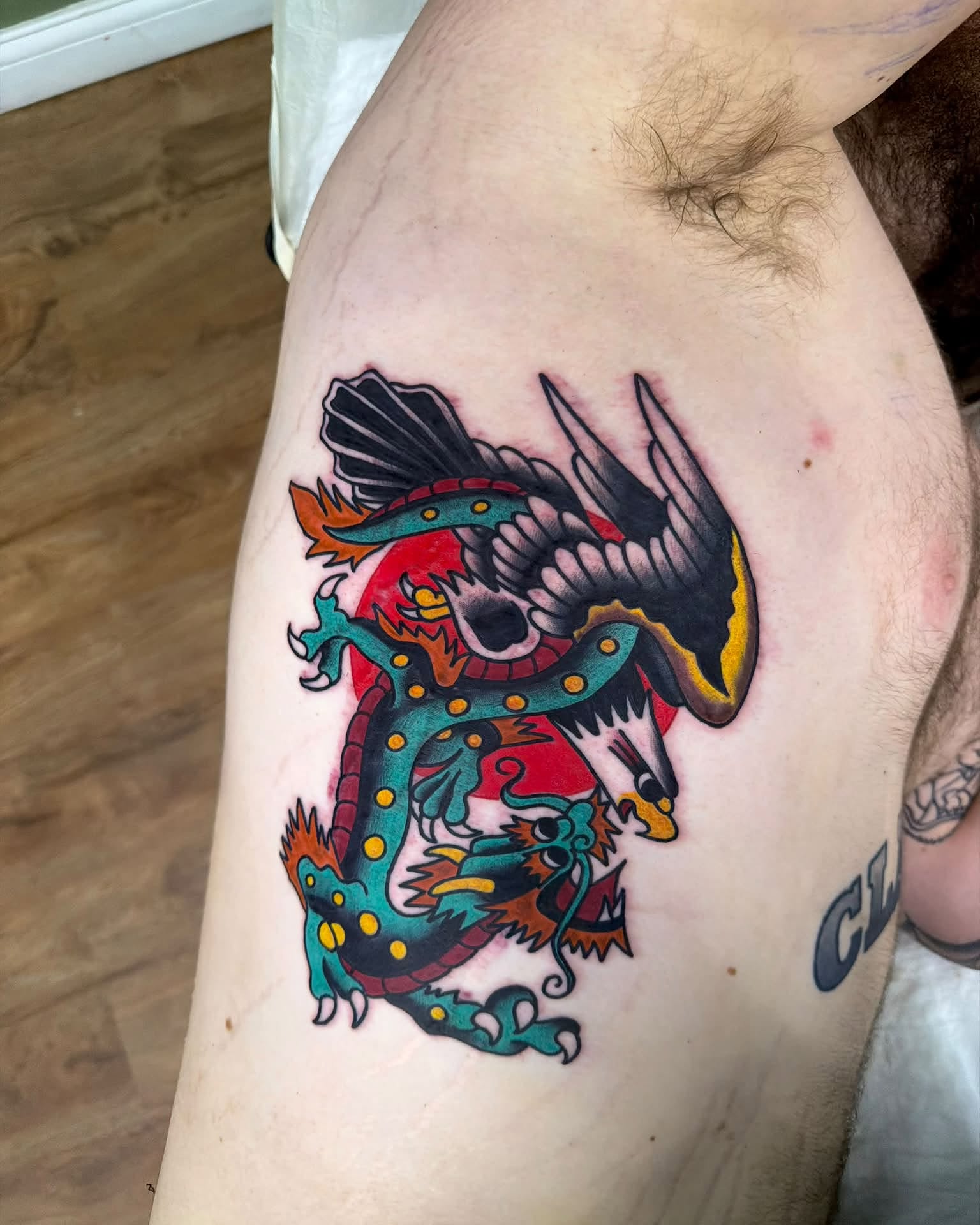 Dragon American traditional tattoo on the thigh by Corey Bailey, Stanton, Kentucky