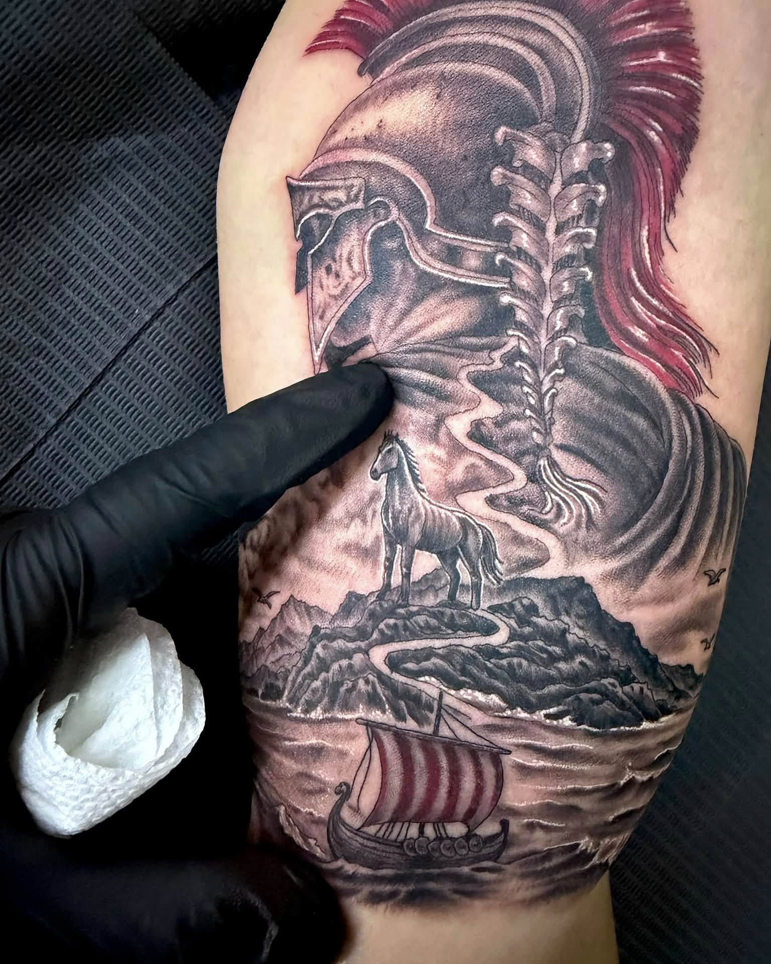 Warrior helmet and horse realism tattoo on the forearm by Corey Bailey, Stanton, Kentucky