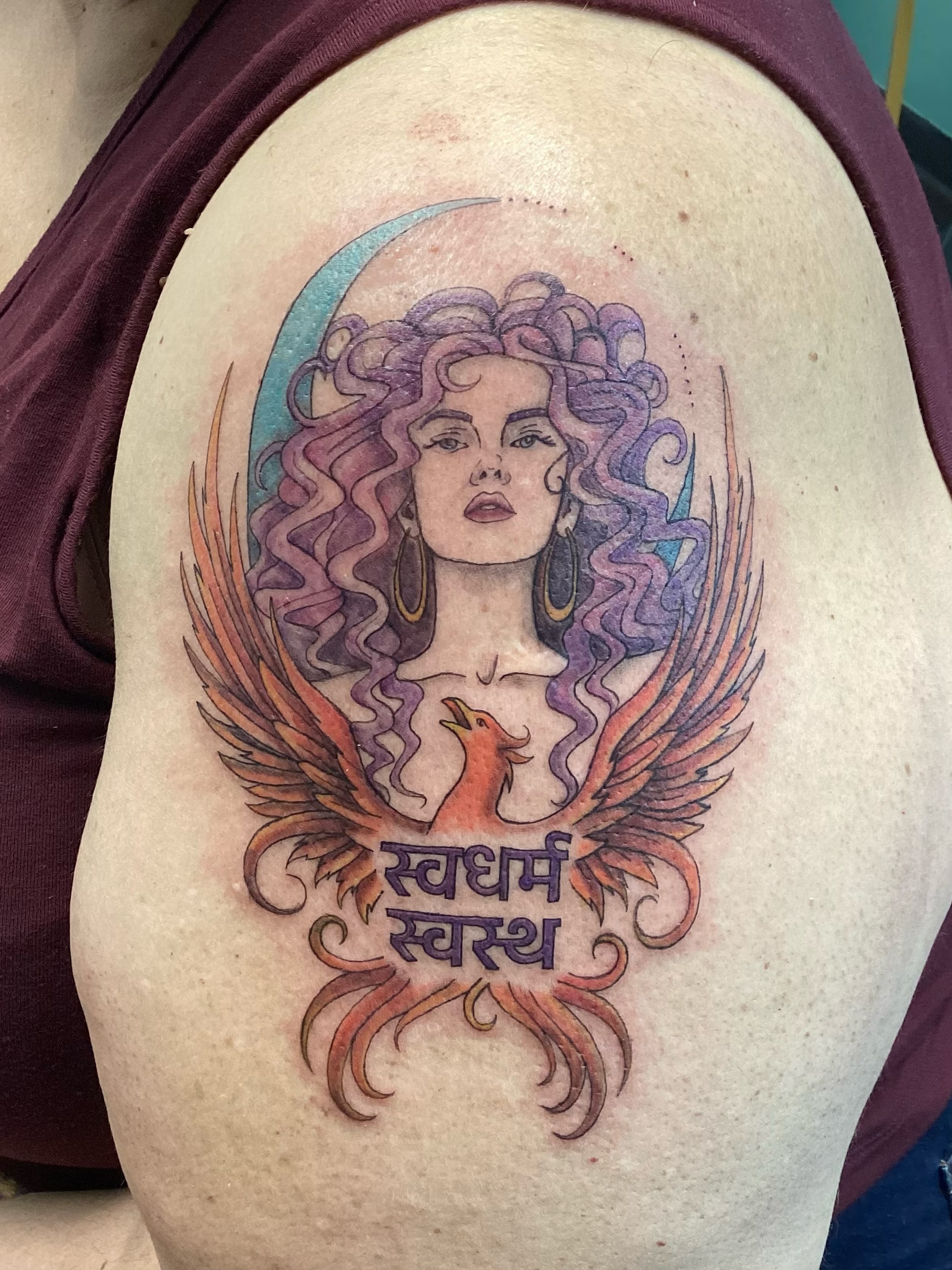 Phoenix and woman illustrative tattoo on the shoulder by Amanda Plavan