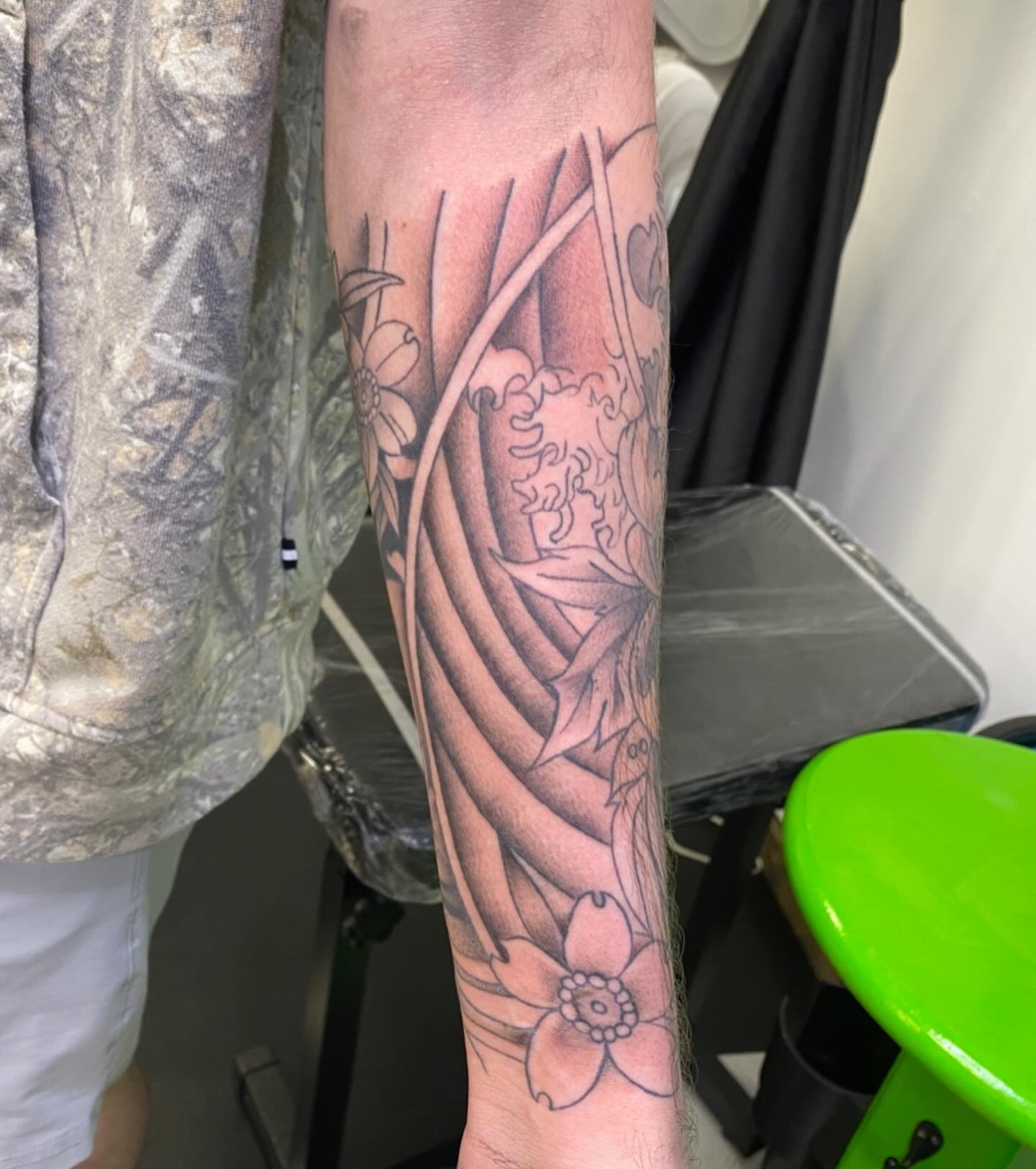 Floral vine realism tattoo on the forearm by Spencer Jones Tattoos
