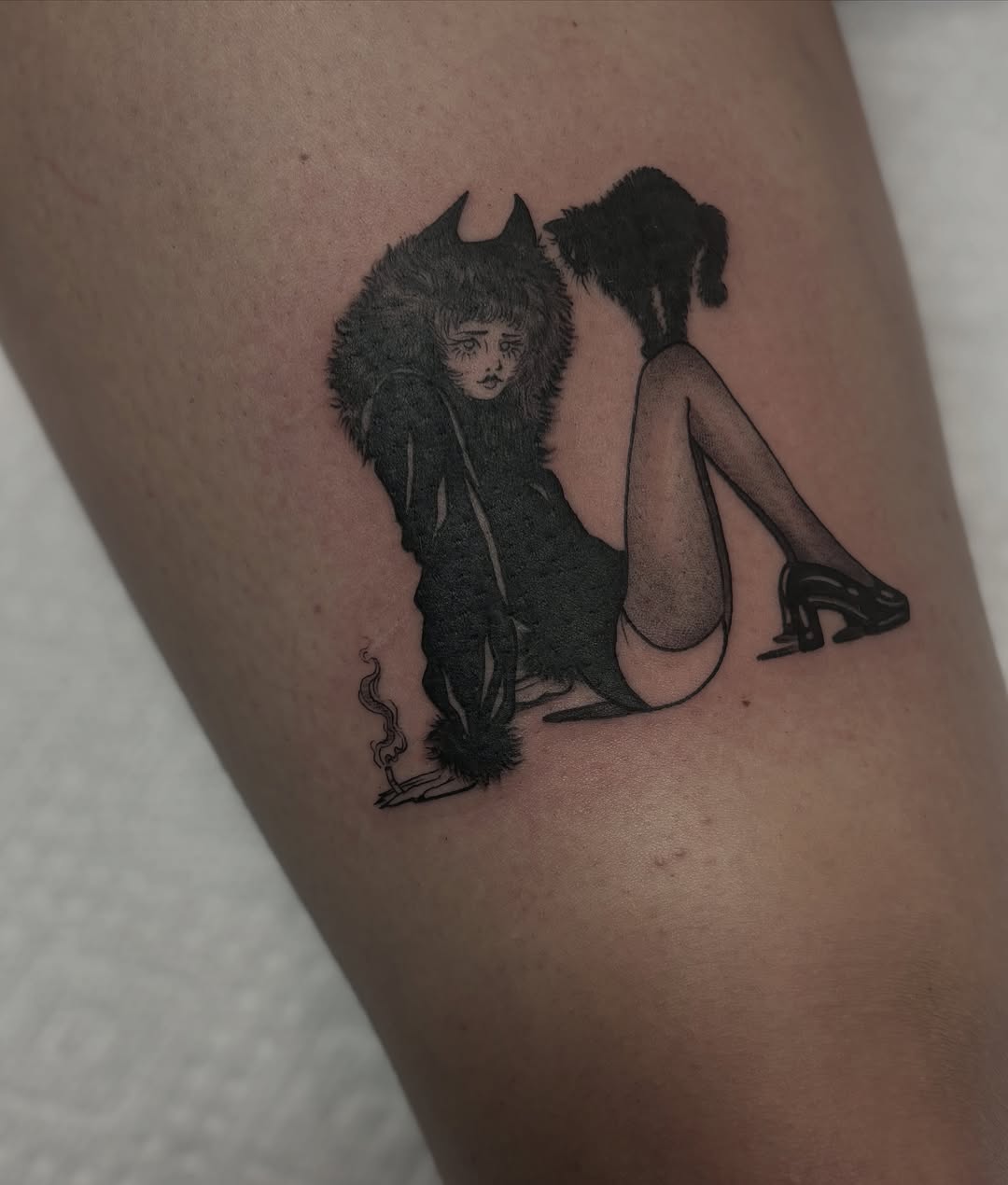 Furry figure and woman dark realism tattoo on the thigh by Genevieve Ehlers, Denver, Colorado