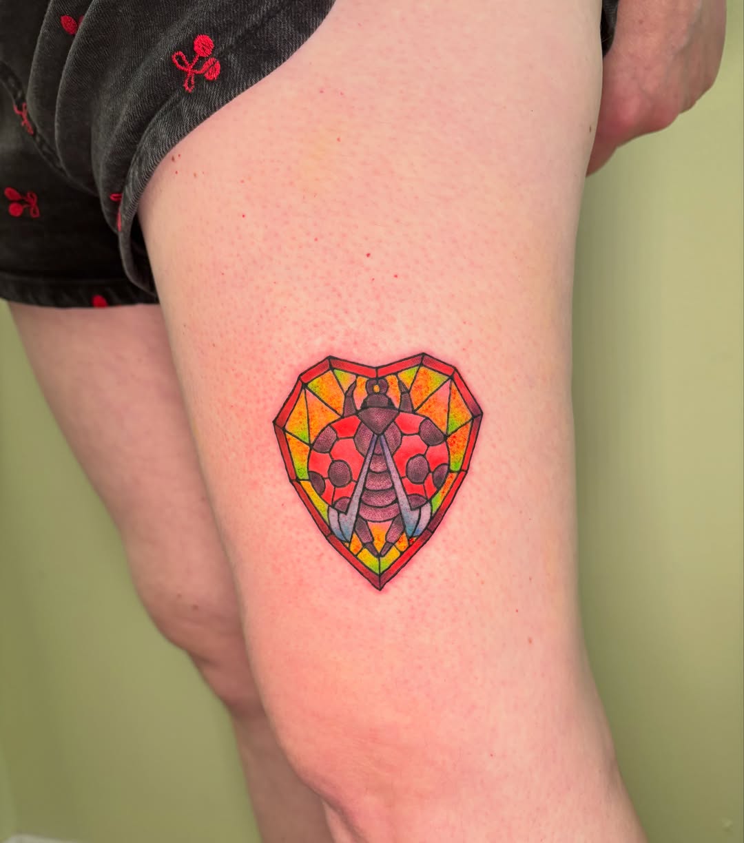 Geometric heart geometric tattoo on the thigh by Chloe Shay
