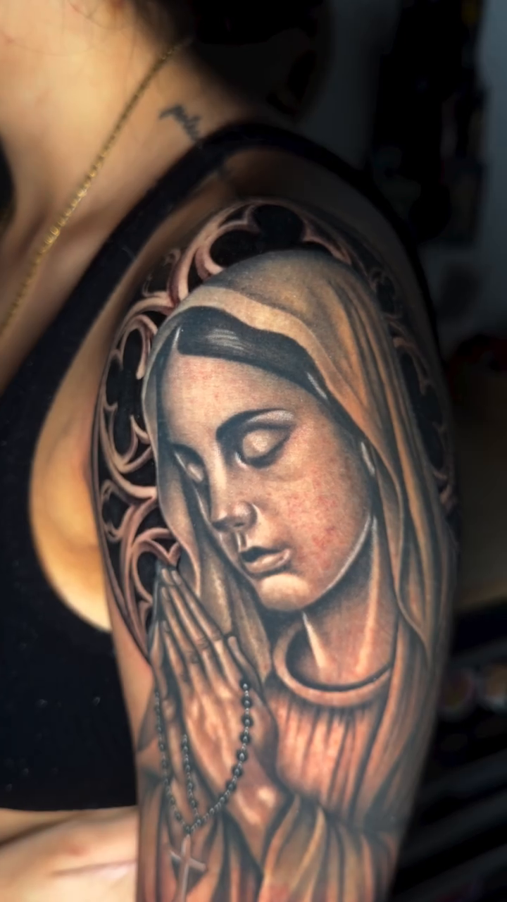 Virgin Mary with lilies realism tattoo by professional tattoo artist