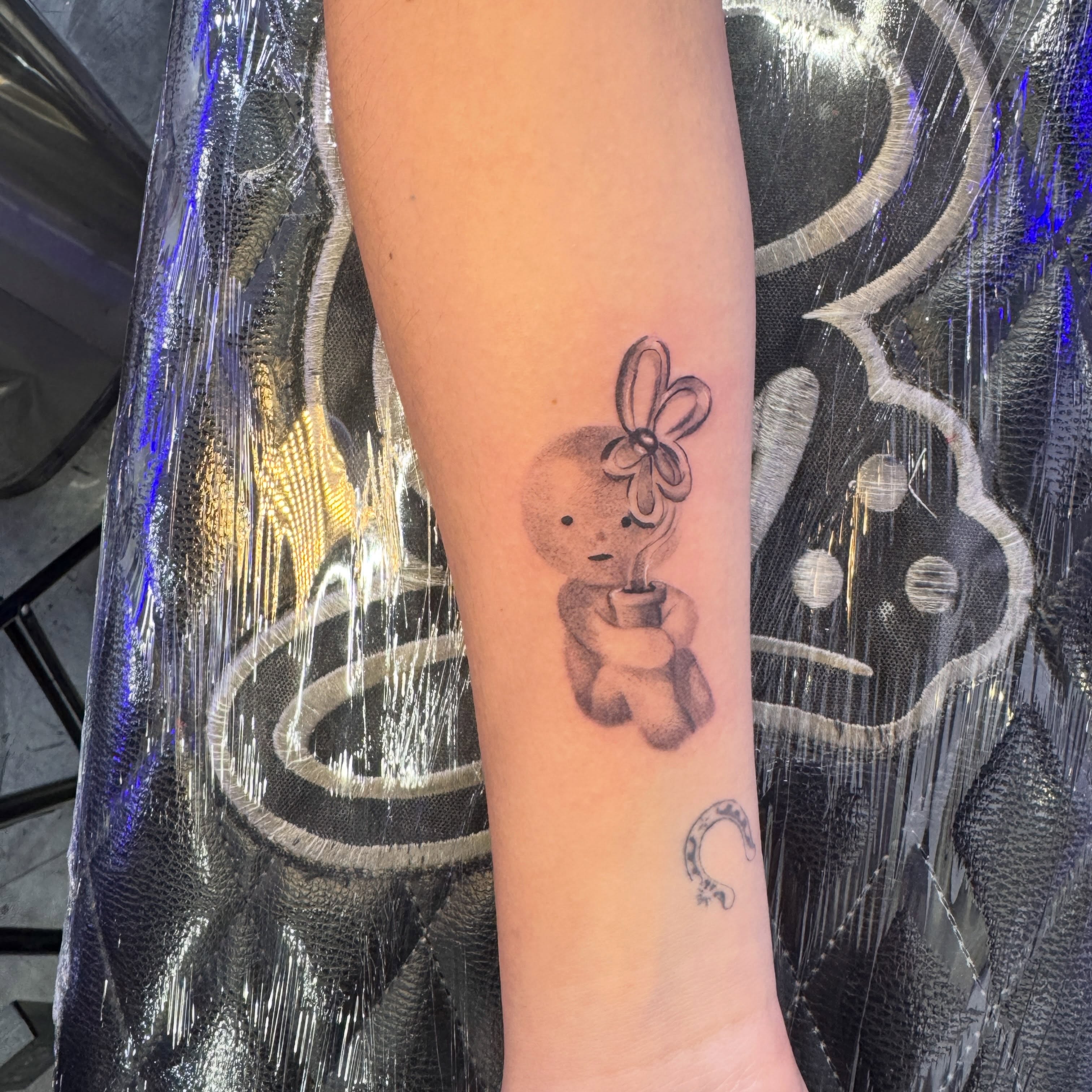 Teddy bear black and grey tattoo on the forearm by Stephy, Minneapolis, Minnesota