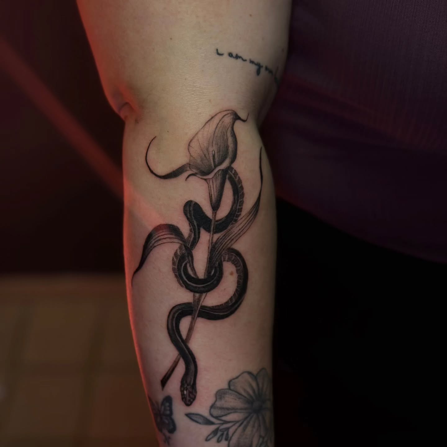 Snake and flower realism tattoo on the forearm by 🌙 Alessio