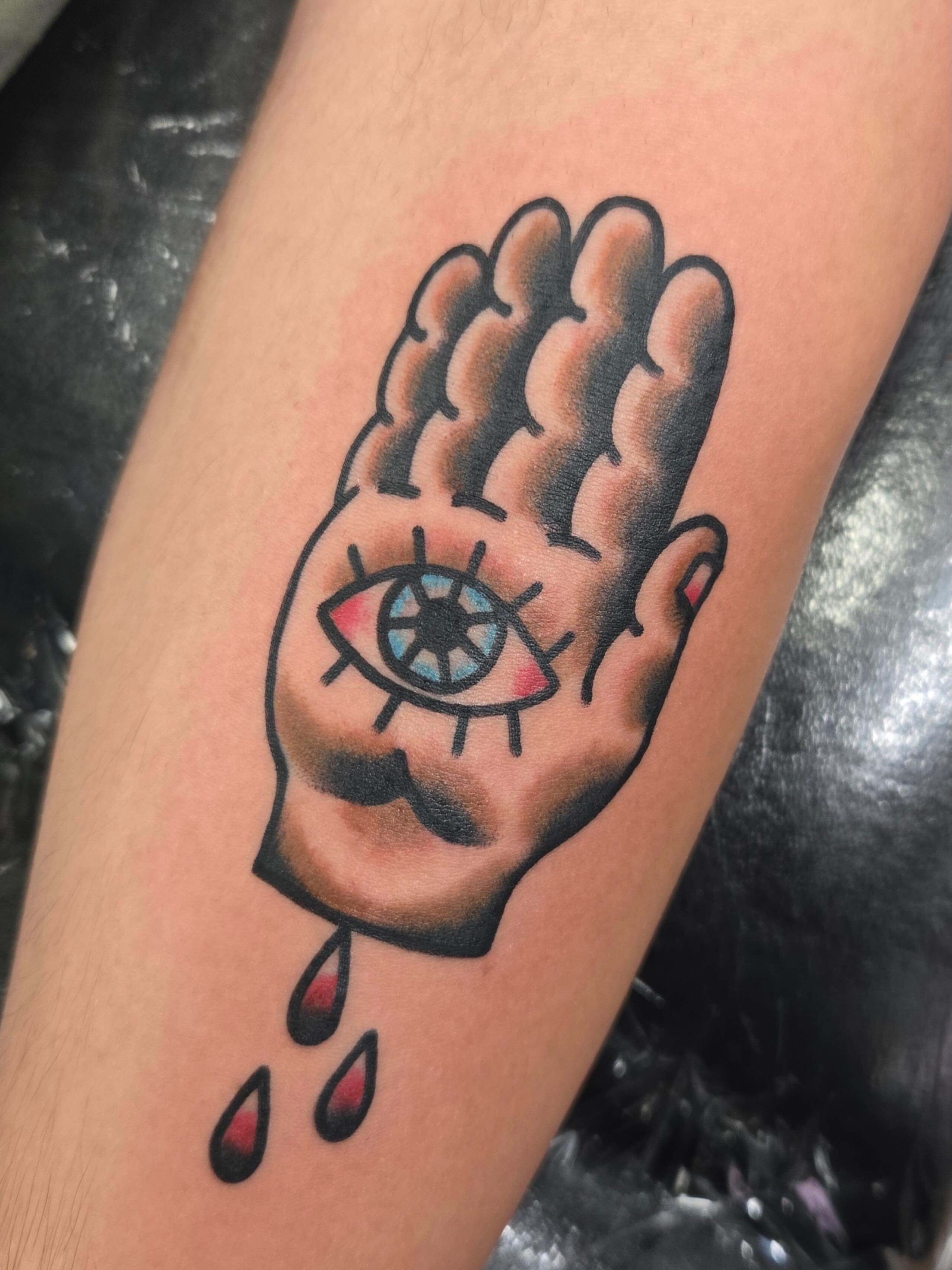 Eye in hand American traditional tattoo on the forearm by ๐