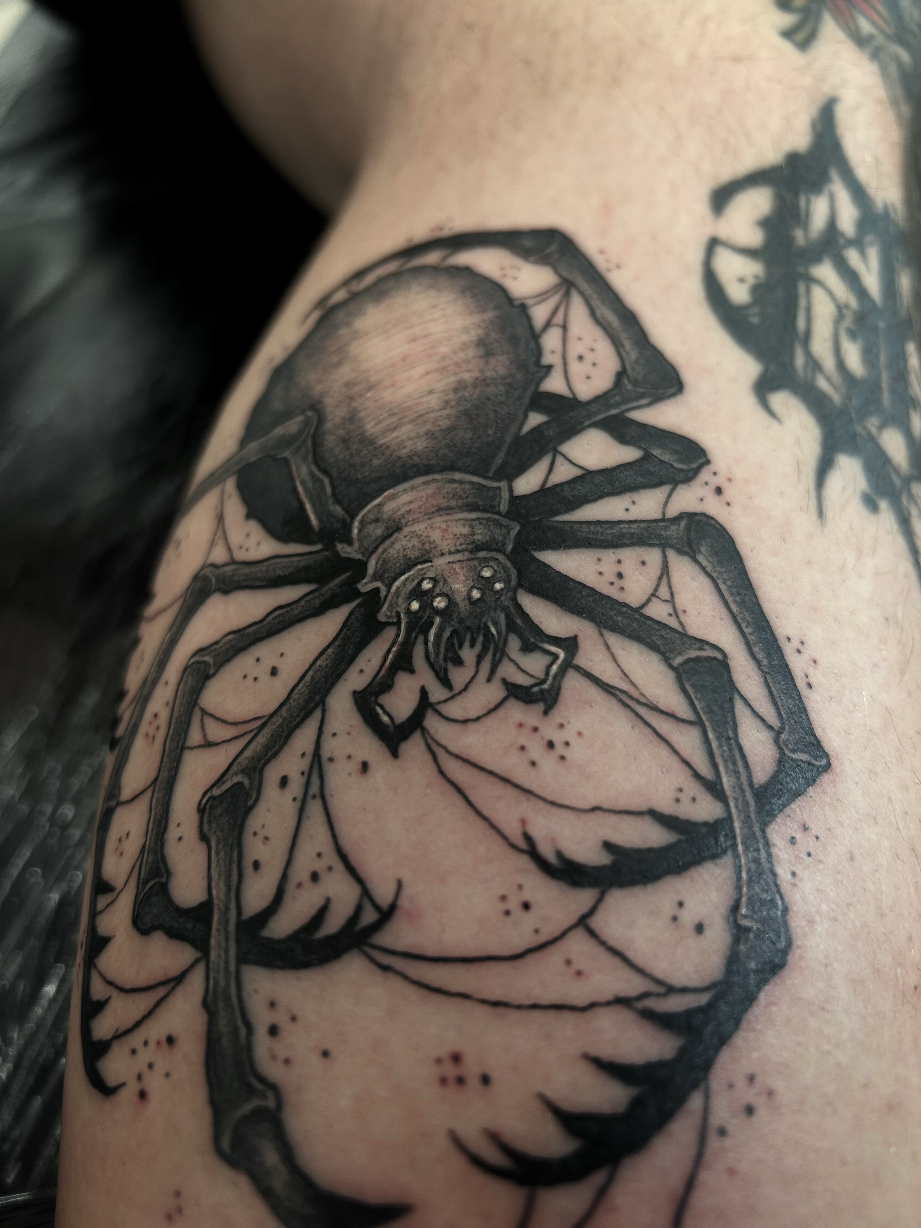 Tattoo by @scorchedbones_ — black_and_grey, realism