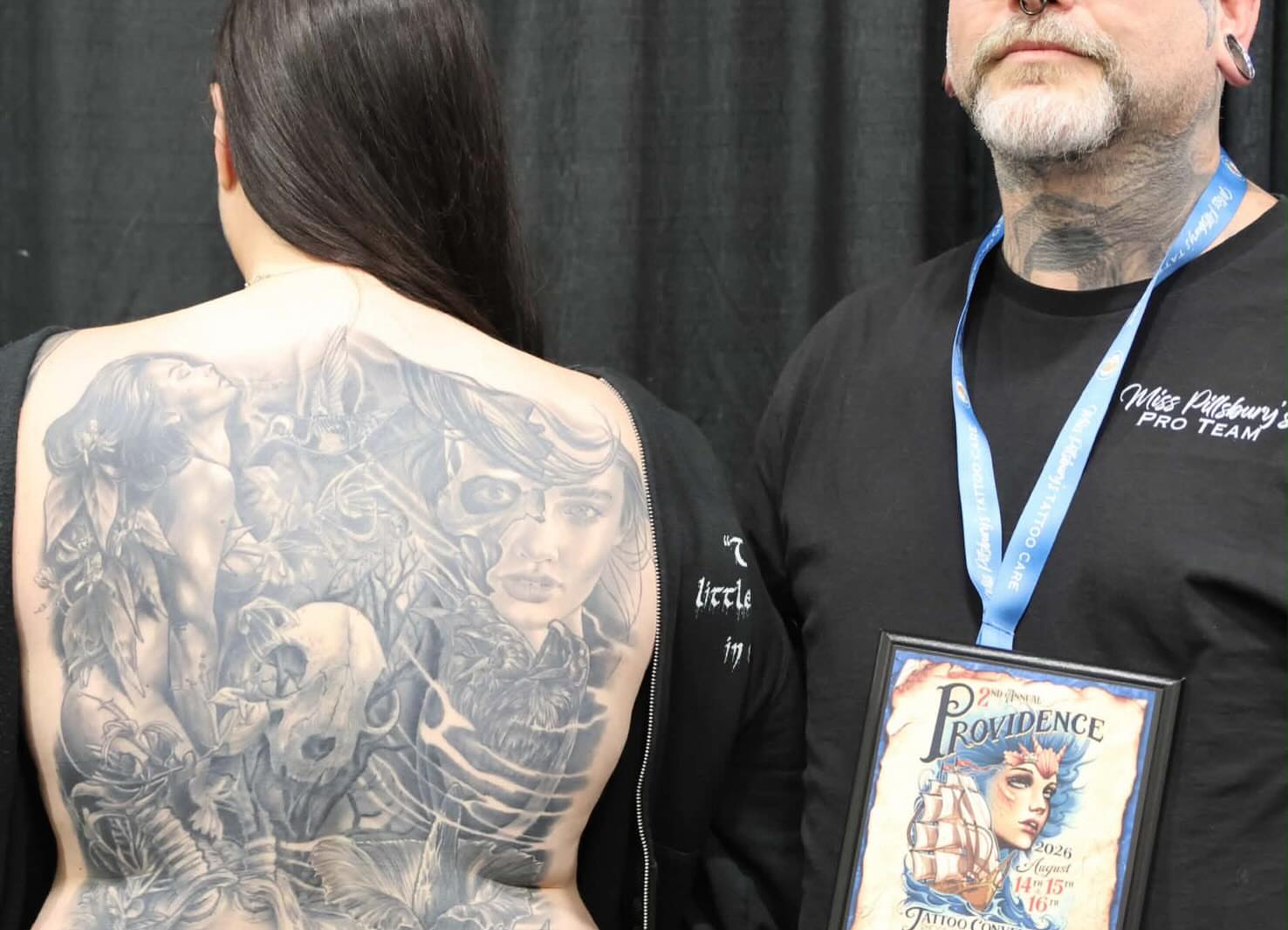 Woman with dragon realism tattoo on the back by Frank DeMao