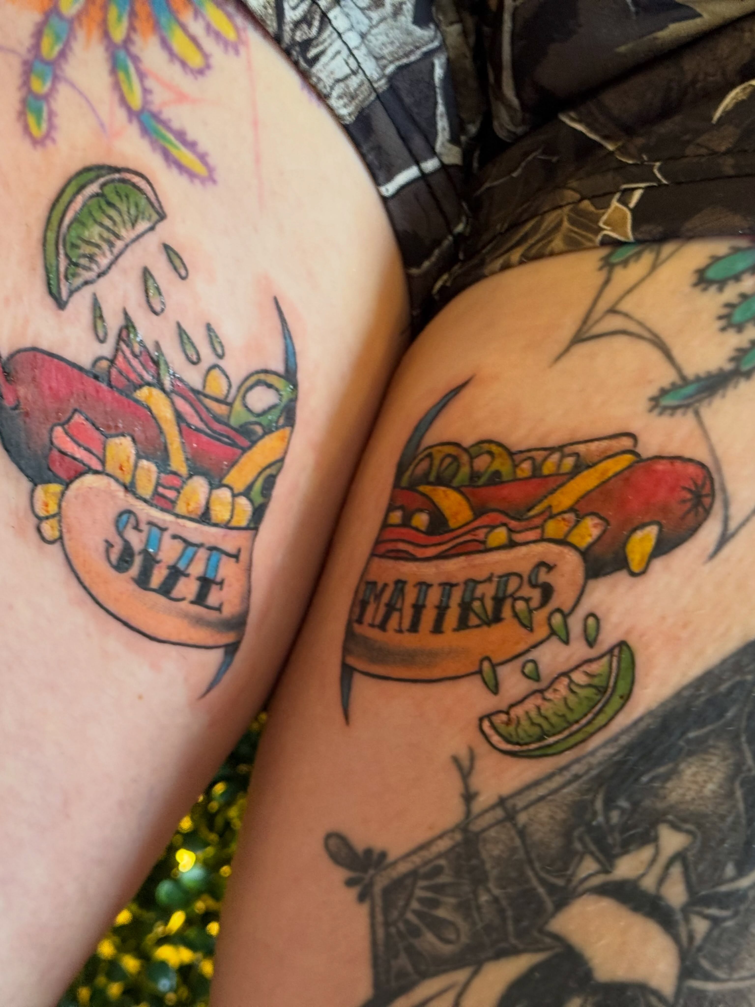 Hot dog American traditional tattoo on the upper arm by Lauren Horness