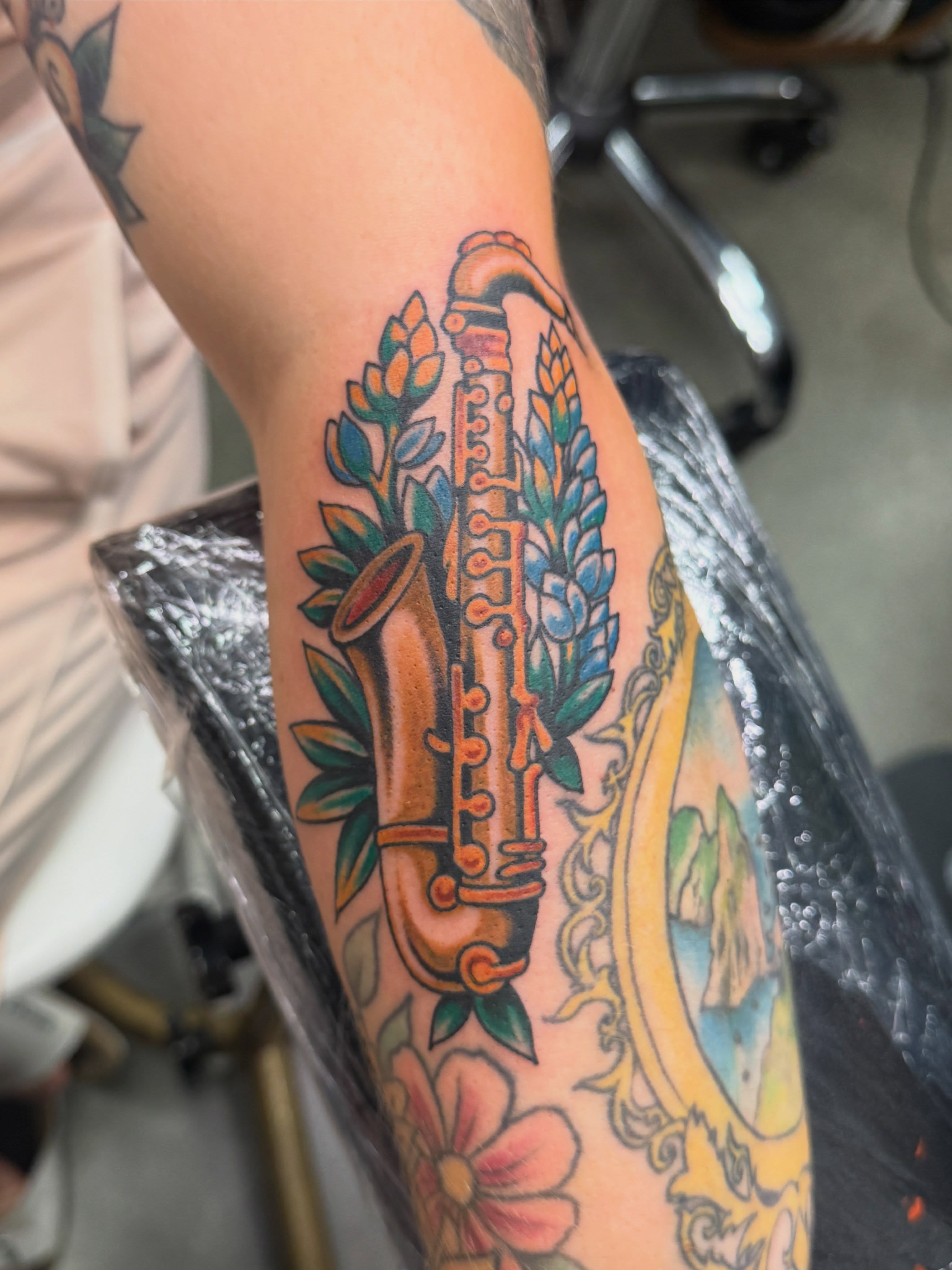 Saxophone American traditional tattoo on the forearm by Angus Perfect, Philadelphia, Pennsylvania