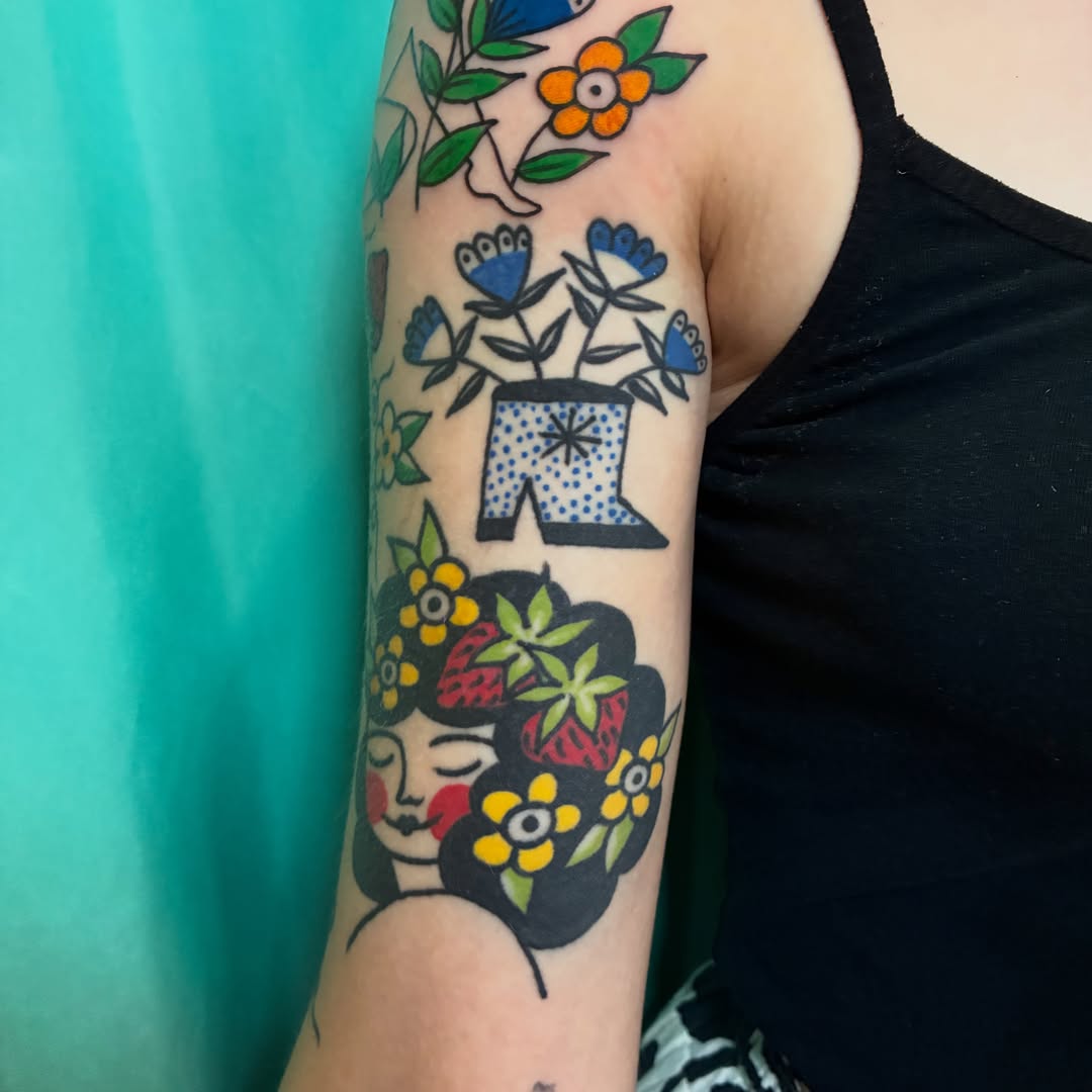 Floral woman American traditional tattoo on the forearm by Kaily McKee