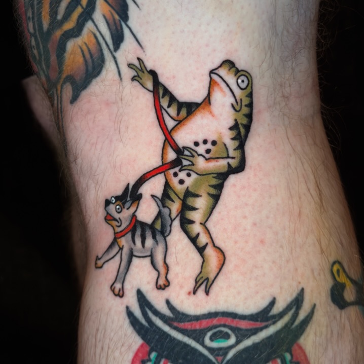 Cat and lizard American traditional tattoo on the forearm by Allie Barringer