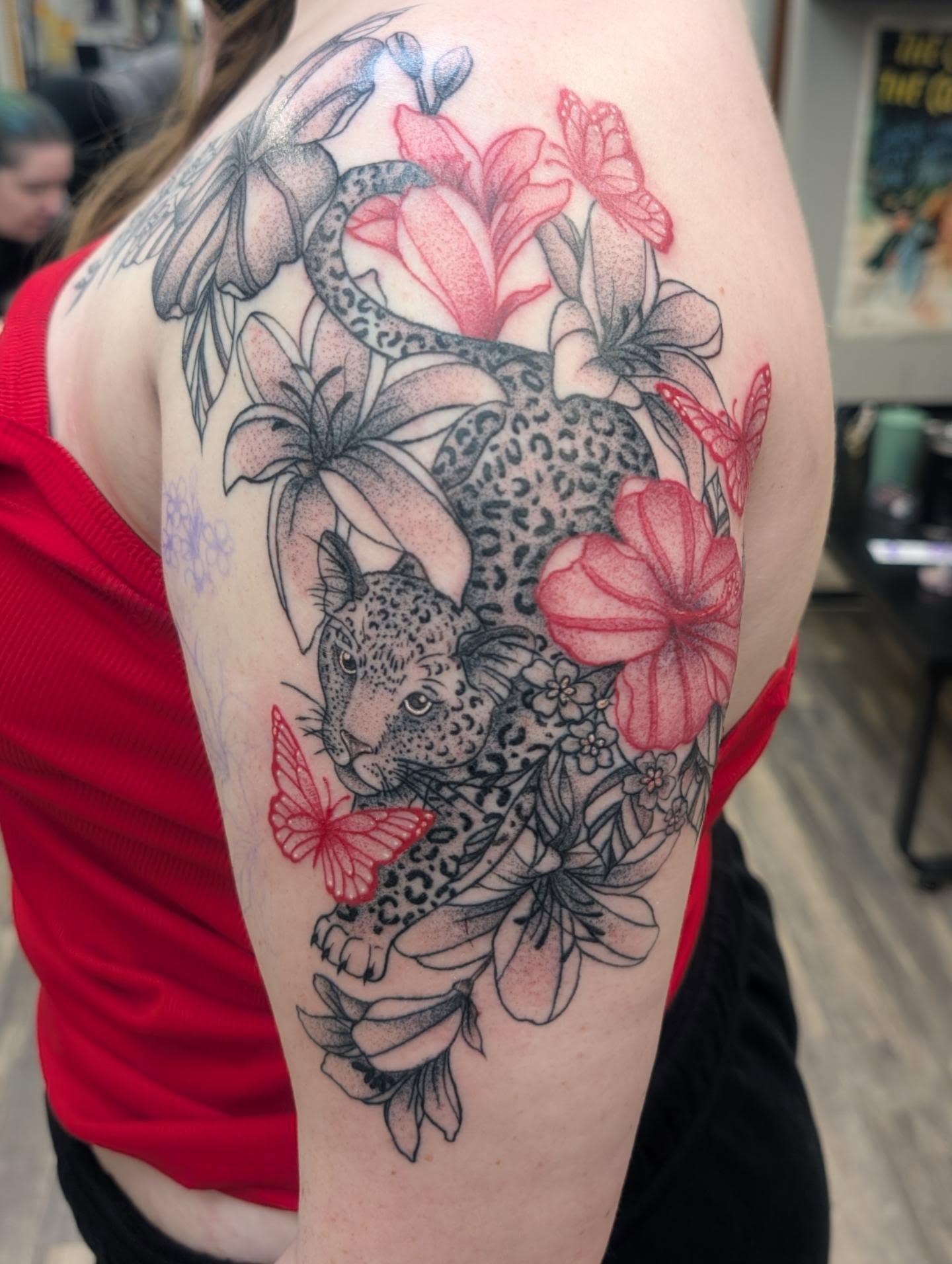Leopard and flowers dotwork tattoo on the shoulder by Talia Zula, Loveland, Ohio