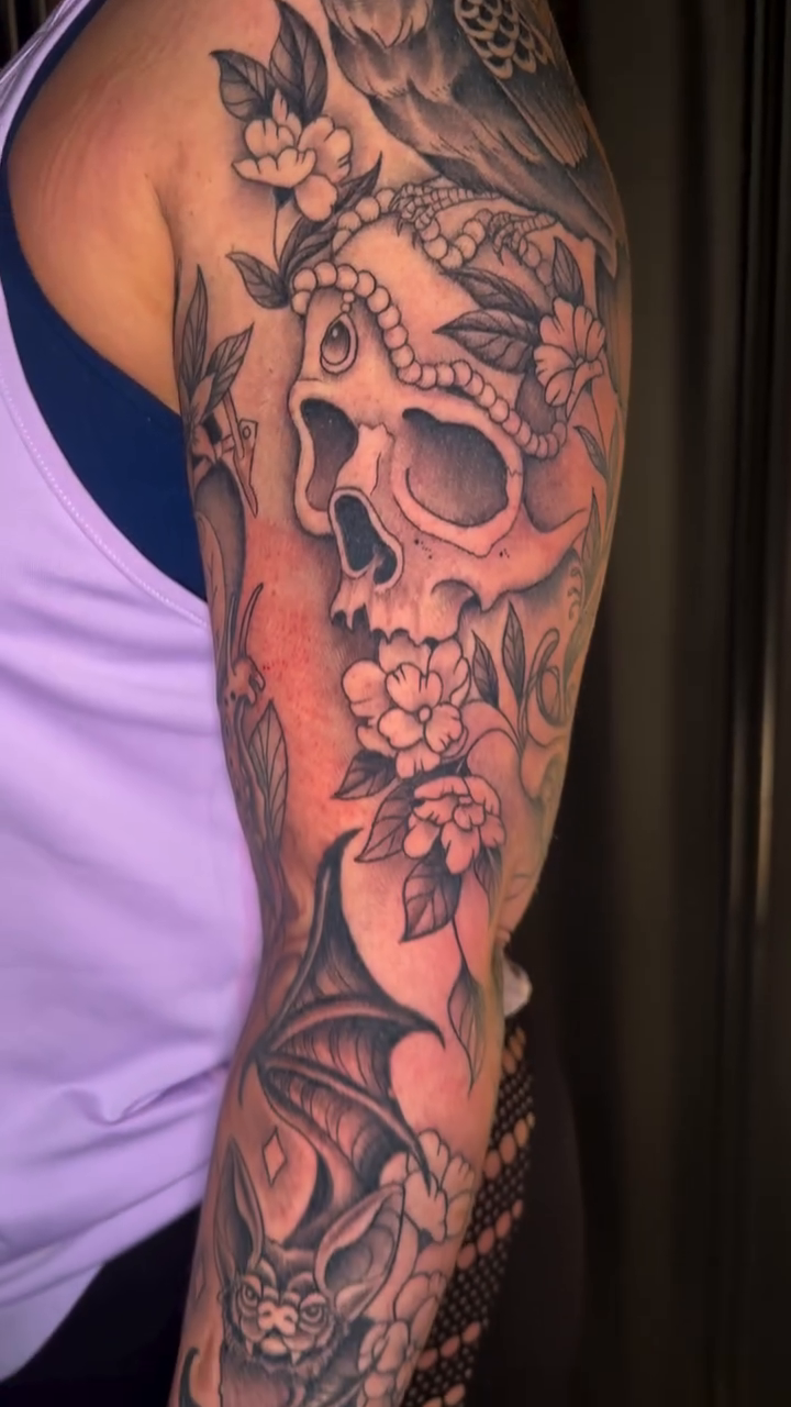 Skull with owl and flowers realism tattoo by Lindsey Bendsey