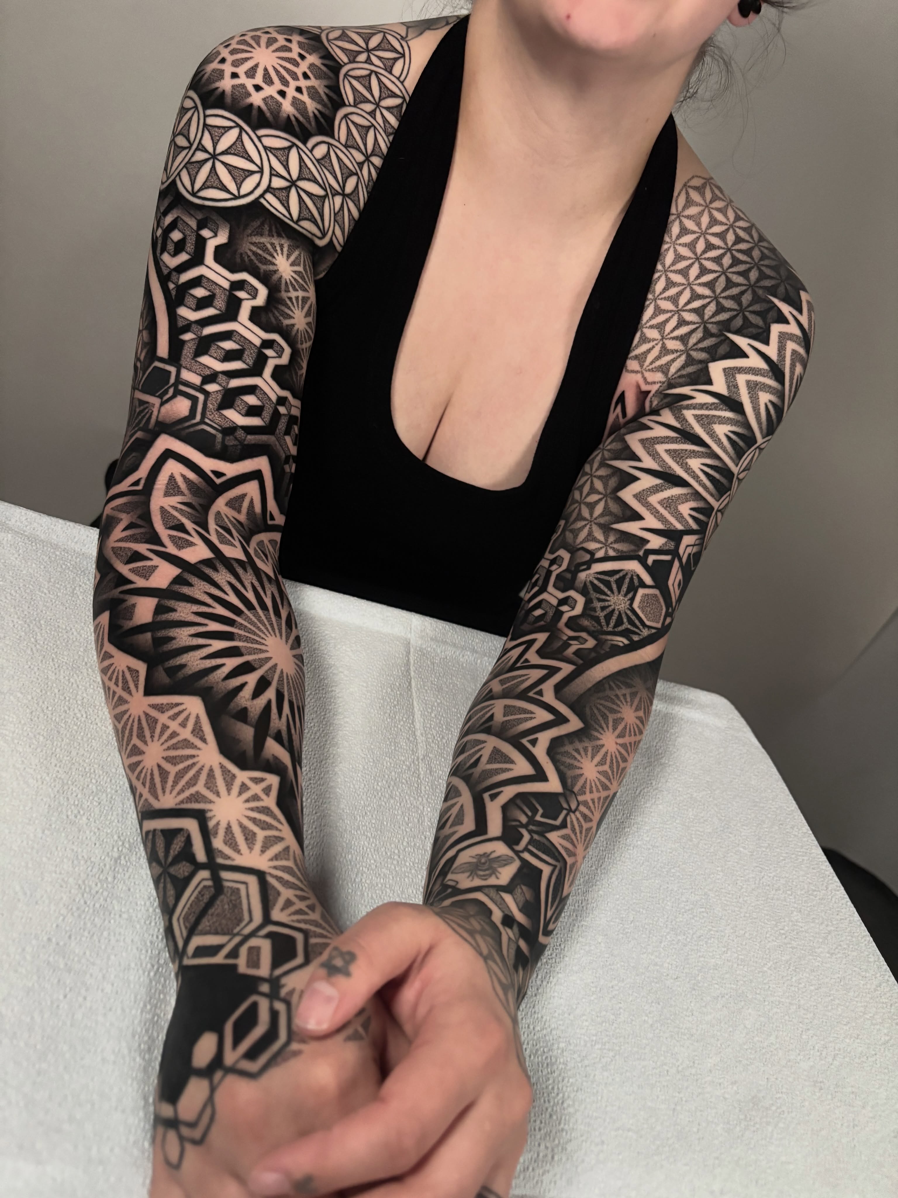 Geometric patterns geometric tattoo on the upper arm by Mitch Koch