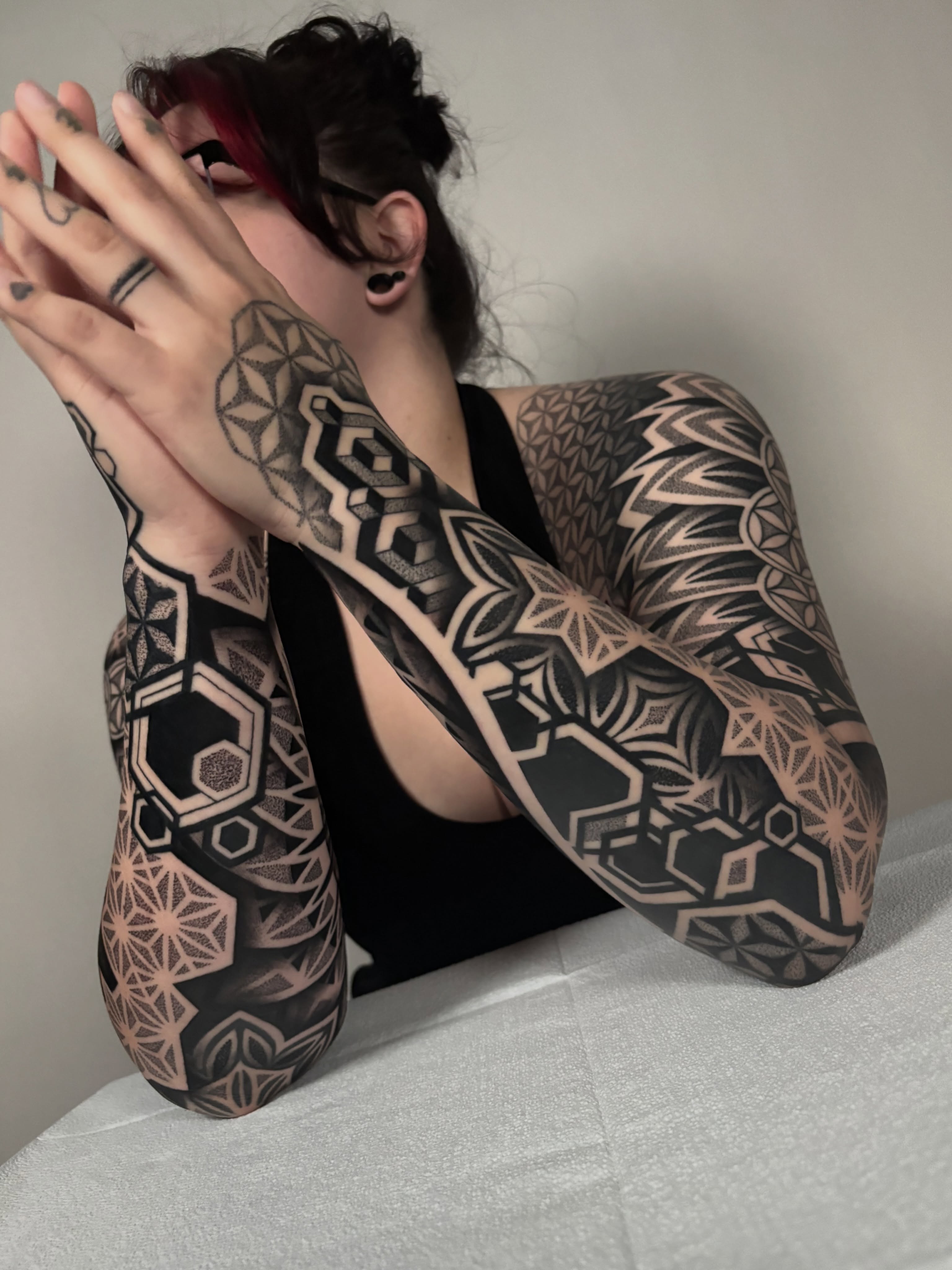 Geometric patterns geometric tattoo on the upper arm by Mitch Koch