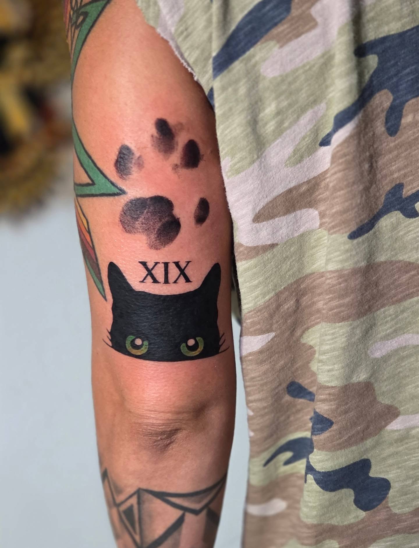 Black cat realism tattoo on the forearm by Yvette Cebreros