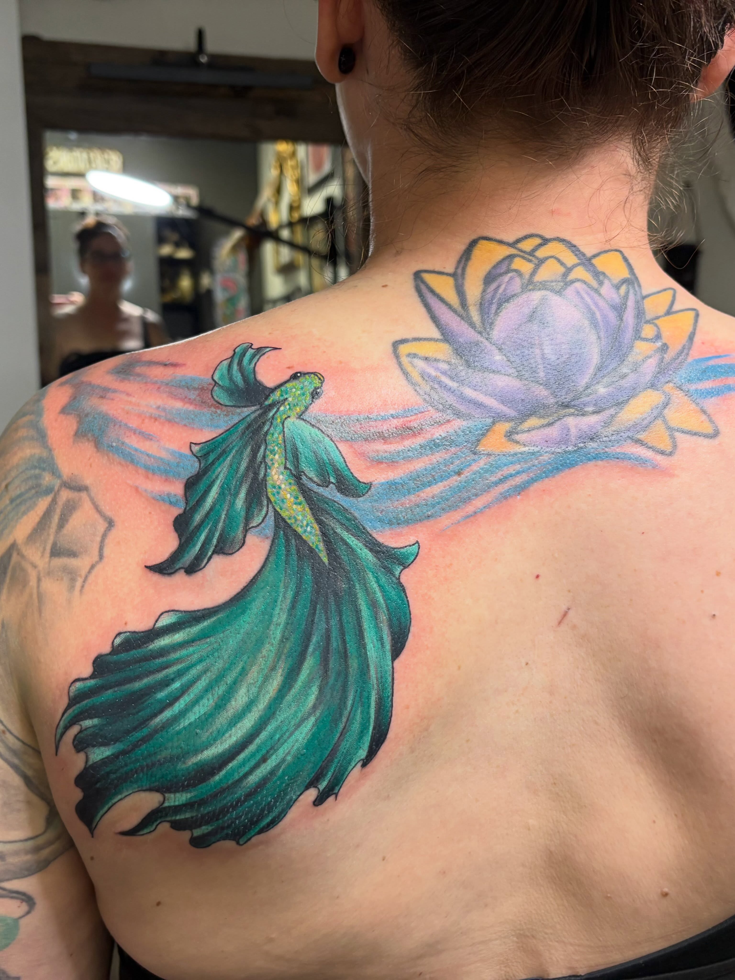 Mermaid and lotus new school tattoo on the back by Julie Bird