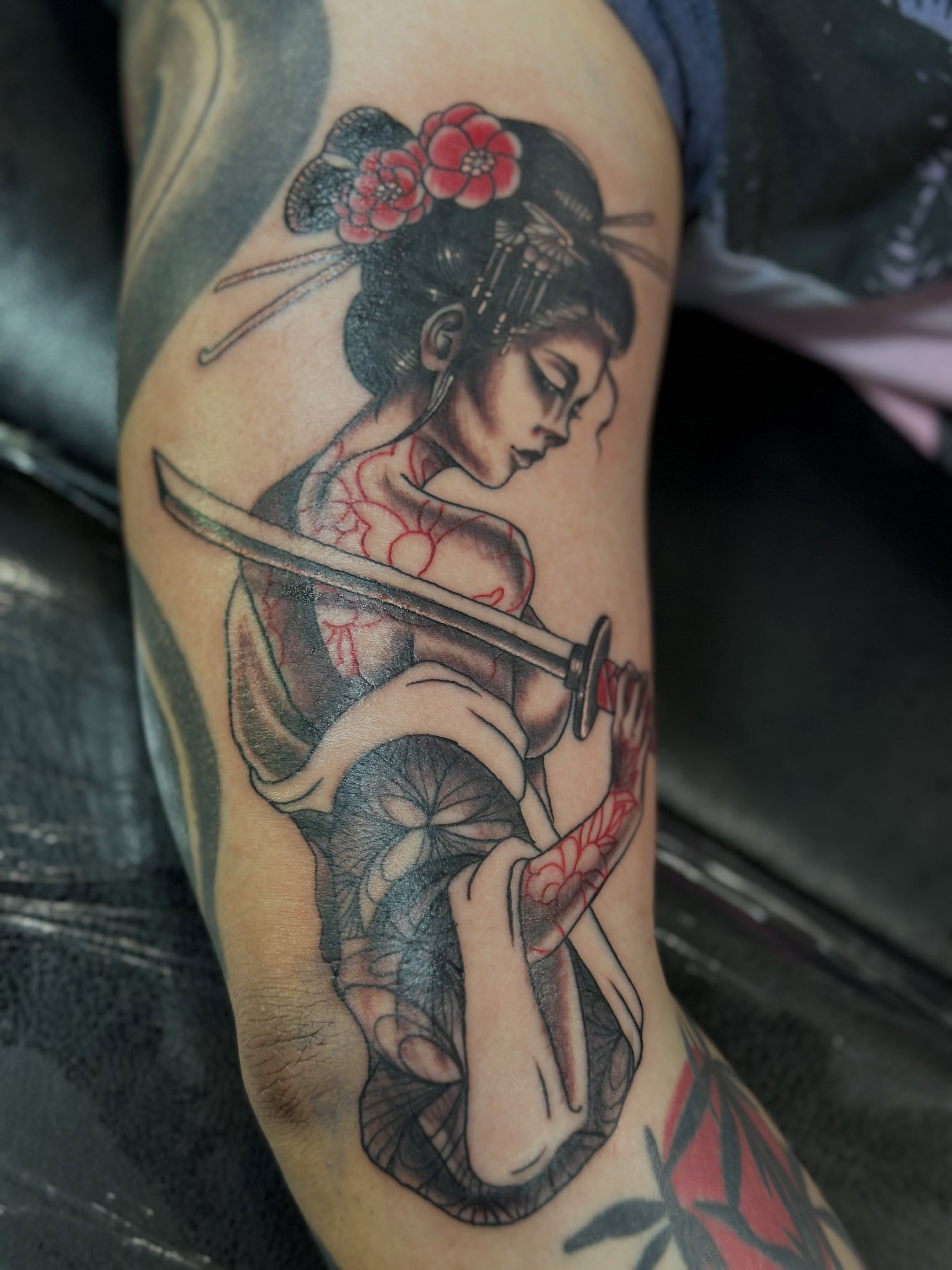 Geisha with sword japanese irezumi tattoo on the forearm by Julie Bird