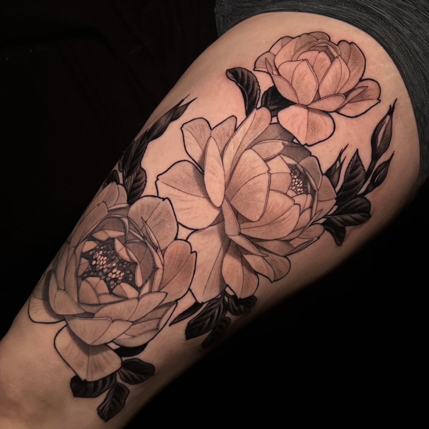 Peony flowers realism tattoo on the thigh by Breah Beshore Kirk