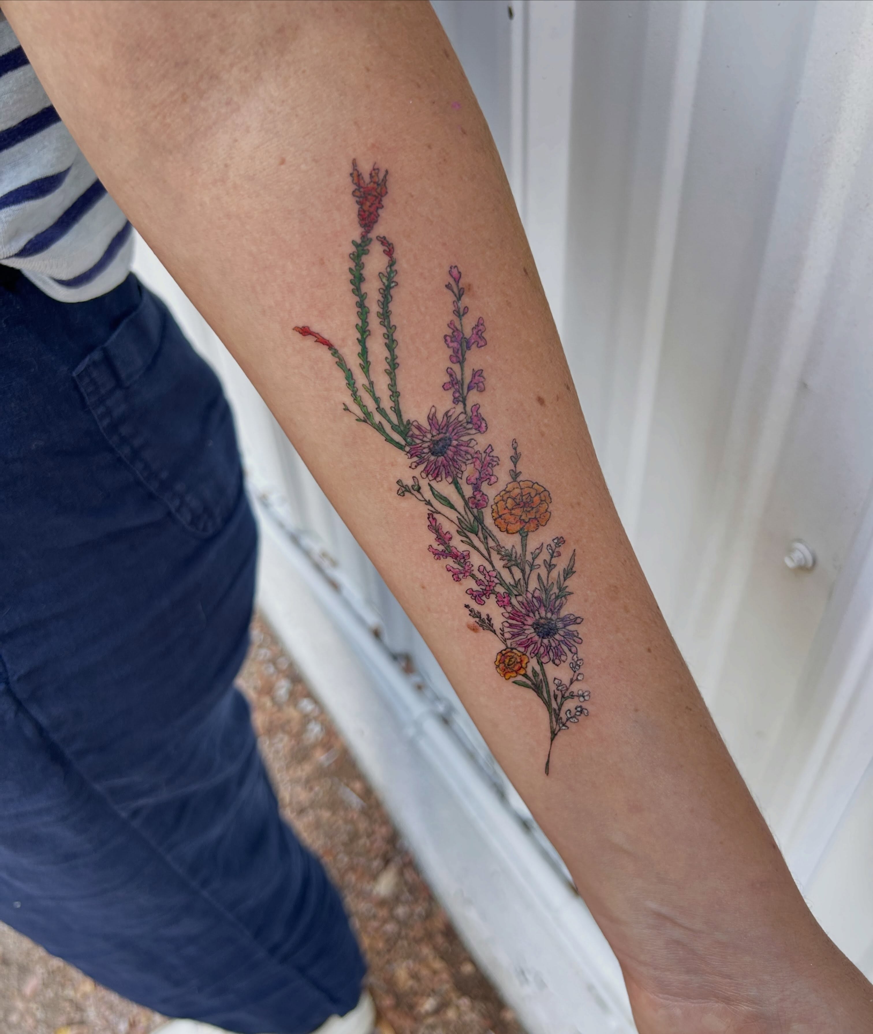 Floral arrangement dotwork tattoo on the forearm by Miss Katie