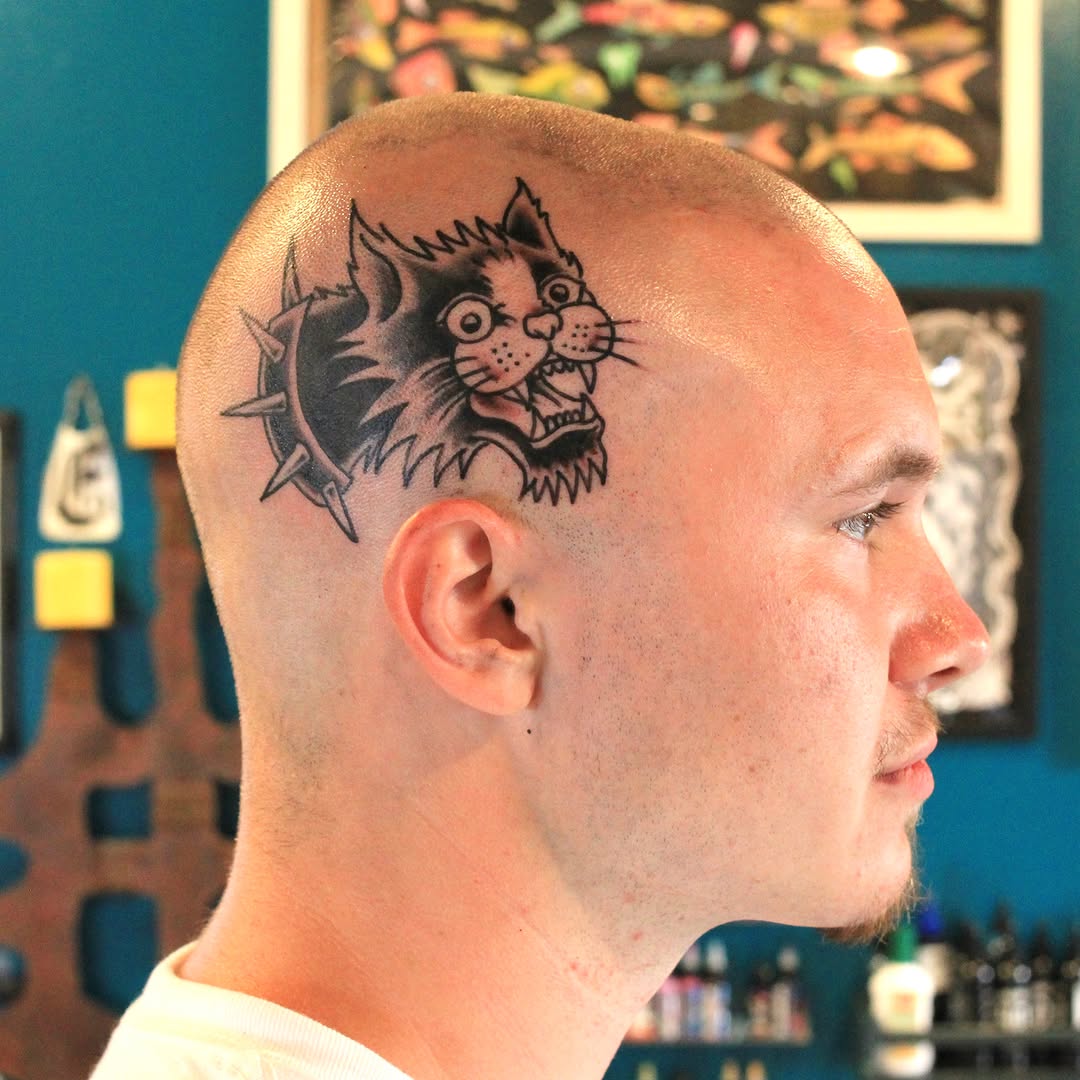 Cat black and grey tattoo on the head by Anthony Robles