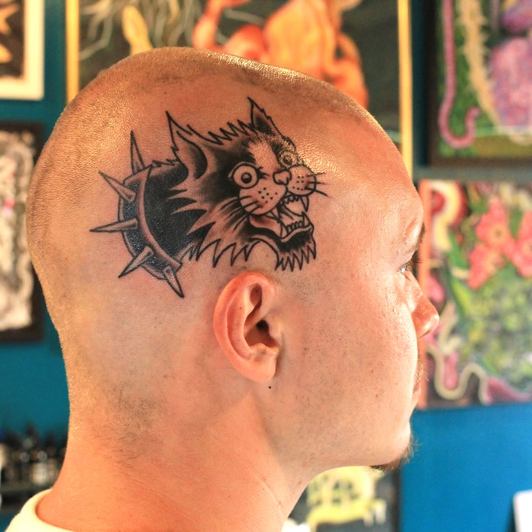 Cat with thorns black and grey tattoo on the head by Anthony Robles