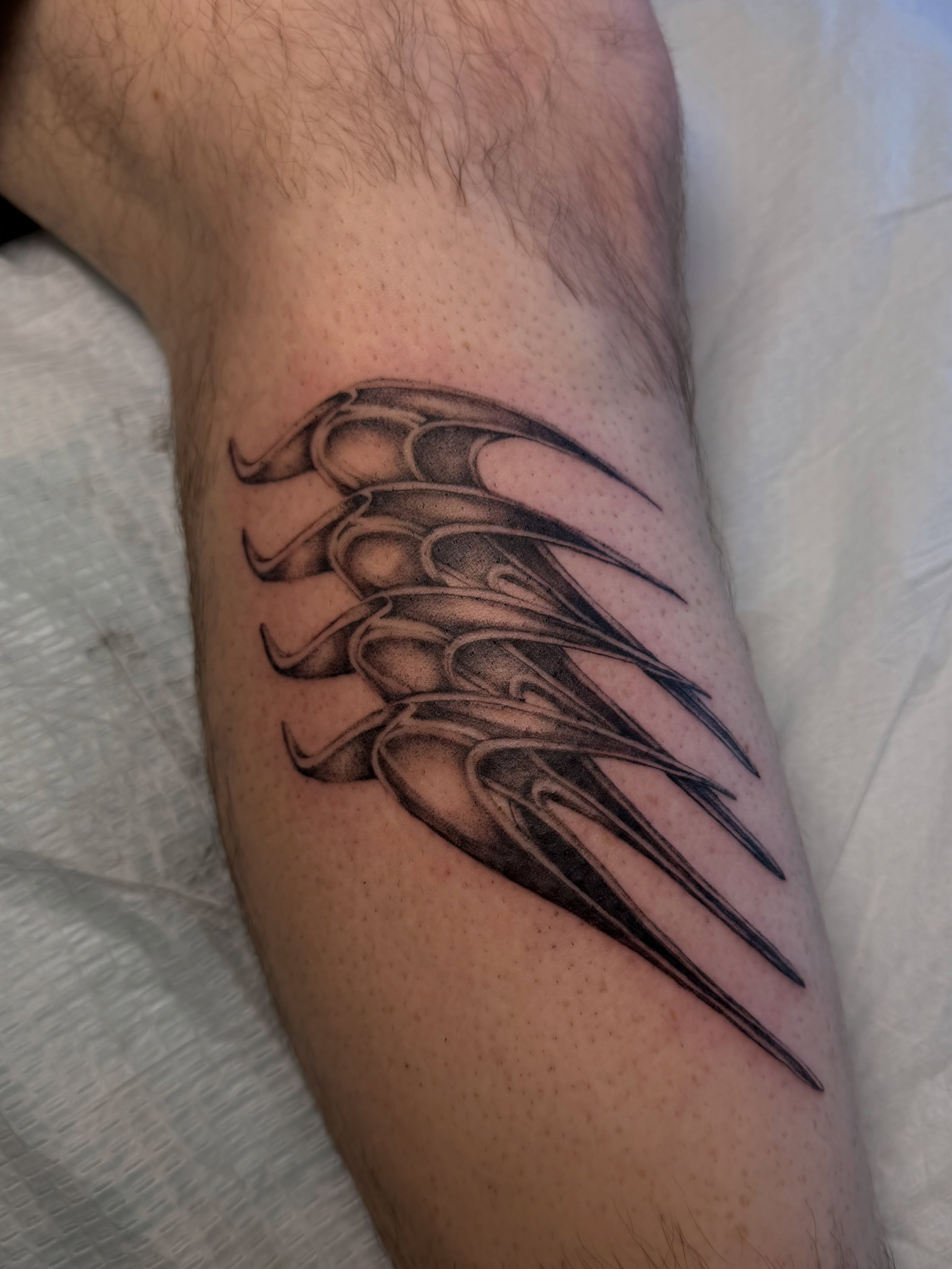 Flame black and grey tattoo on the forearm by Lauren ๐