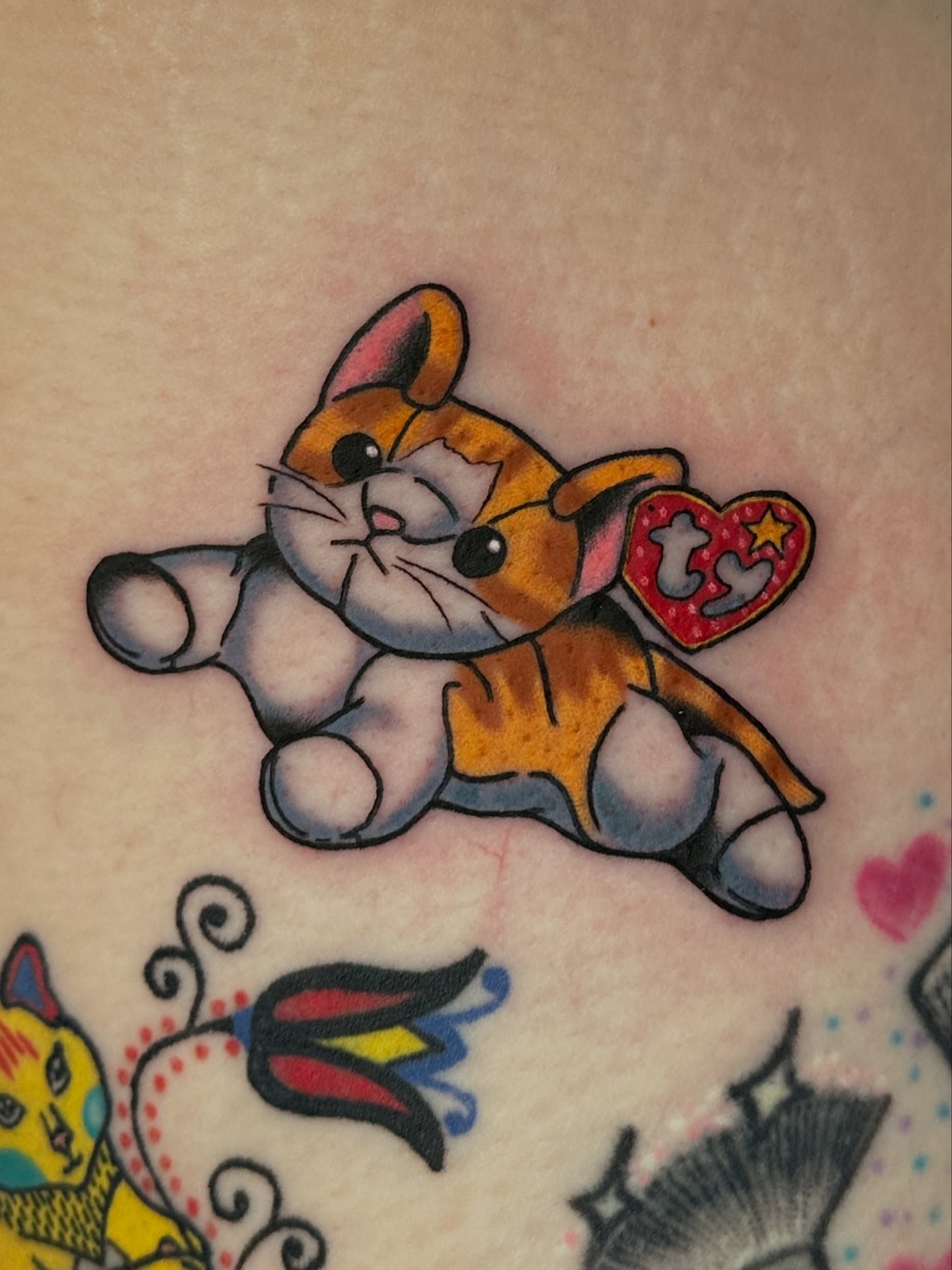 Cat plushie illustrative tattoo by Paige Ochoa