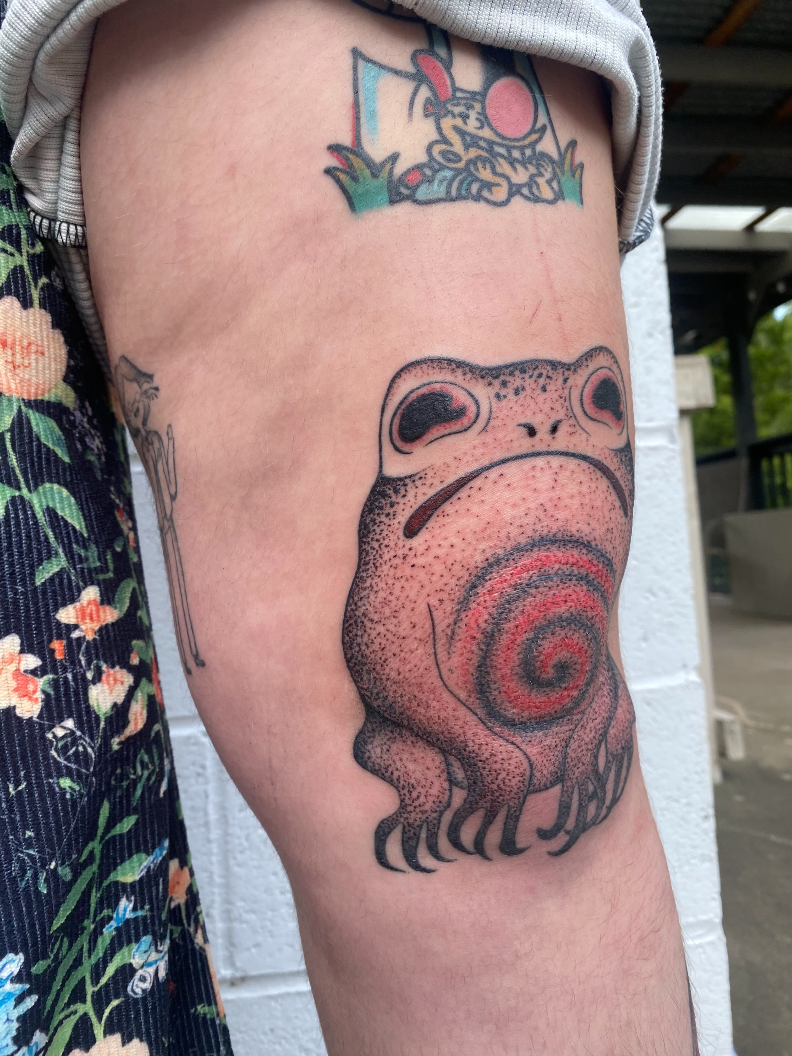 Frog dotwork tattoo on the thigh by Jesikah Rapp