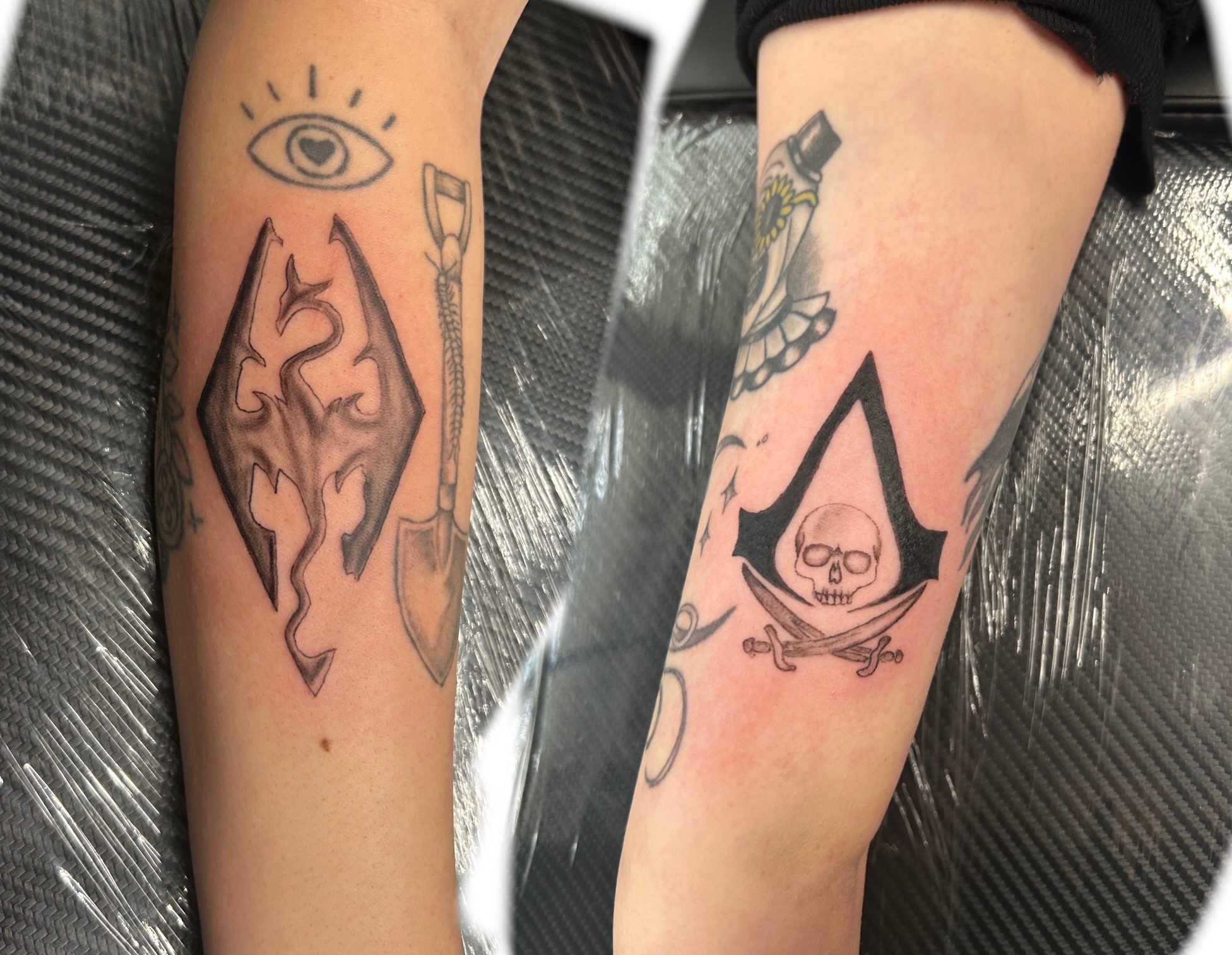 Assassin's creed symbols black and grey tattoo on the forearm by Jessica π