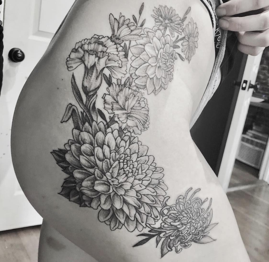 Floral bouquet black and grey tattoo on the thigh by Josh O’ + Bird ☘️ 🪶